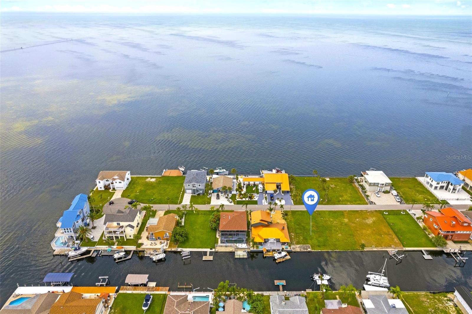 Gulf View Waterfront Vacant Lot. Located in Sea Ranch, a quiet boating/golfcart community and an area of luxurious homes. Lot is situated on the first canal in from the Gulf, providing easy Gulf access to some of the best inshore/offshore fishing in the area! Property offers 65 ft of Concrete Seawall to accommodate boatlifts, dockage and boating needs. Gulf access is not tide limited for most boats and there are No Bridges. Enjoy incredible views of the Gulf of Mexico and fabulous sunsets along with viewings of dolphins and manatees. Kayak to nearby Werner-Boyce Salt Springs State Park, where you can fish, kayak and enjoy the serene home to a variety of marine birds and wildlife. Hudson Beach is just a short golfcart or boat ride away and offers great restaurants, entertainment, 4 marinas, boat rentals, charter fishing, public boat ramp and a beach area for swimming. Nearby Sunwest Park with over a mile of Clearwater Beach quality sand, is a beautiful County Park where swimming, wakeboarding, beach volleyball, splash pad can be enjoyed by family and friends. Close to many amenities including, medical services, hospitals, shopping and more.45 minutes to Tampa International Airport, 2 hrs. to Orlando. Building and financing information available.