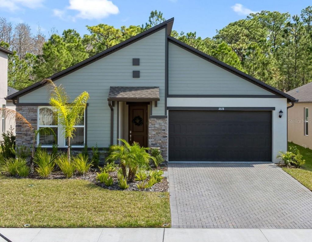 Photo of 18178 Serene Lake Loop, Lutz, FL 33548 (MLS # TB8484604)