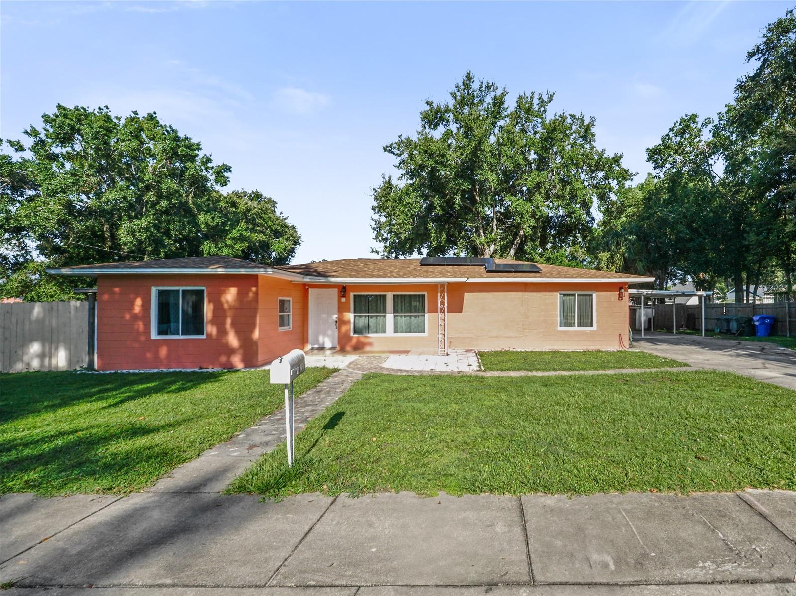 Welcome to a well-maintained corner-lot single-family home! NO HOA. Located 7 minutes from Downtown Kissimmee and only 30 minutes from both Orlando International Airport and the World-famous Disney Parks, this home combines classic charm with everyday convenience. Built in 1953, the home features a spacious layout with 3 bedrooms and 2 full bathrooms, ideal for families, first-time buyers, or savvy investors. The kitchen is equipped with stainless steel appliances, and the living areas provide plenty of room to relax and entertain. Step outside to a large, fenced backyard with two covered areas- ideal for entertaining and relaxing. Solar panels already installed for added efficiency. Situated in a non-HOA neighborhood close to schools, shopping, dining, and major roadways, this home offers both convenience and charm. Don't miss this great opportunity to own a home in the growing Kissimmee area. Schedule your private showing today!