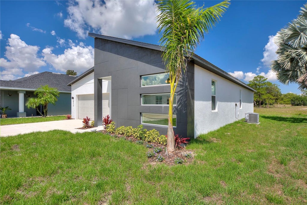 Photo of 113 Victoria Lane, Haines City, FL 33844 (MLS # O6449480)