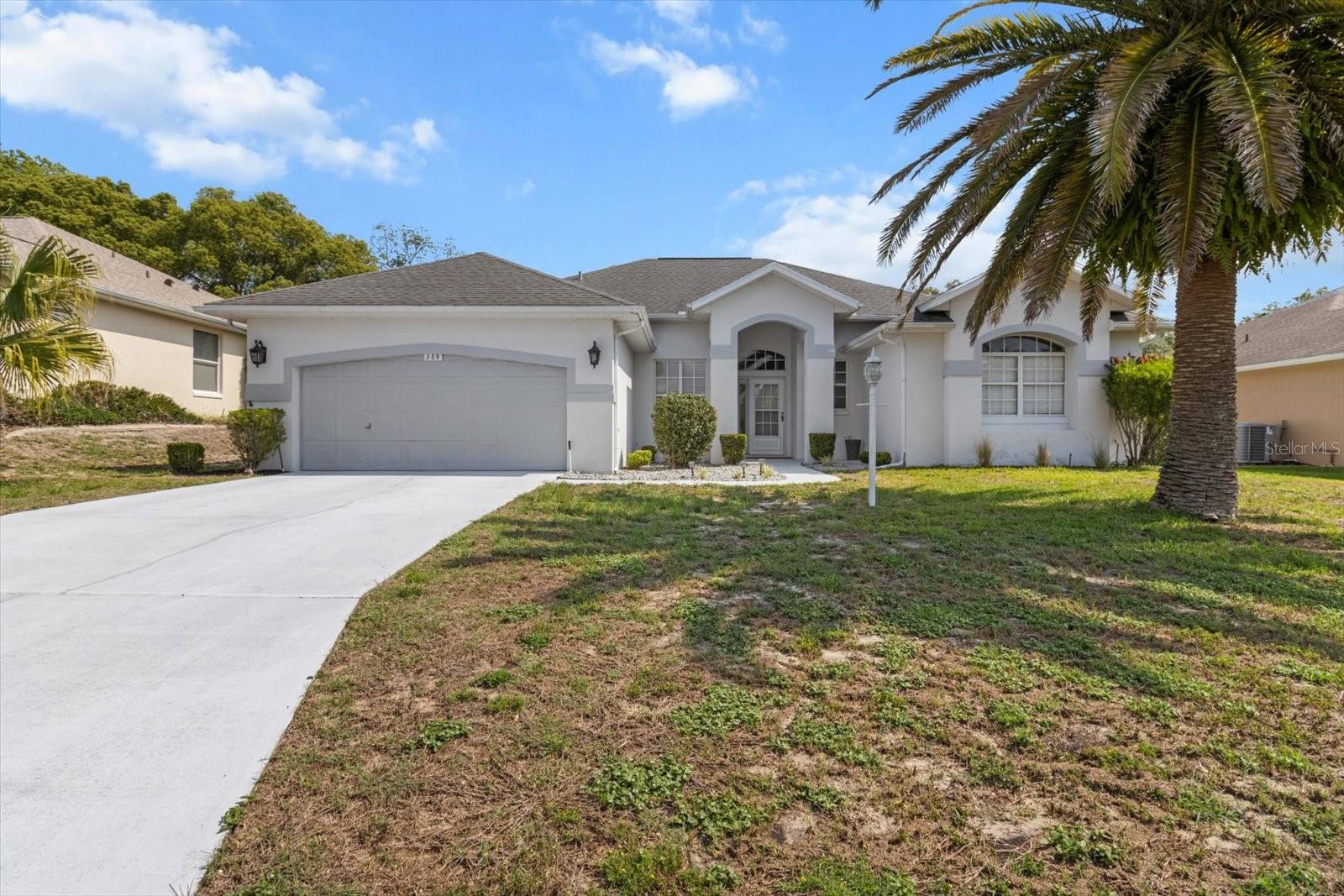 NEW ROOF TO BE INSTALLED PRIOR TO CLOSING.
Welcome to this charming 3-bedroom, 2-bathroom home located at 389 W Hillmoor Ln in Beverly Hills, FL. This move-in ready house offers 2,033 square feet of comfortable living space with high ceilings and ceiling fans throughout.
The main areas feature beautiful hard flooring, while the bedrooms are carpeted for added comfort. You'll love cooking in the kitchen with stainless steel appliances. Step outside to relax on the screened-in back porch, perfect for enjoying Florida's weather year-round.
This home sits in the desirable Laurel Ridge community, which comes with great perks. Residents enjoy access to a community clubhouse and pool, all for low annual HOA fees. Golf lovers will appreciate being close to The Twisted Oaks public golf course.
Location is everything, and this property delivers. You're just minutes away from shopping, restaurants, and essential services. Central Ridge Park is nearby for outdoor activities, and Publix Super Market at Shoppes of Citrus Hills makes grocery runs convenient.
The combination of move-in ready condition, community amenities, and prime location makes this an excellent opportunity. Whether you're looking for your forever home or a great investment, this property checks all the boxes. The open floor plan with high ceilings creates a spacious feel, while practical features like the screened porch add to the home's appeal. Don't miss your chance to call this well-maintained home yours.
