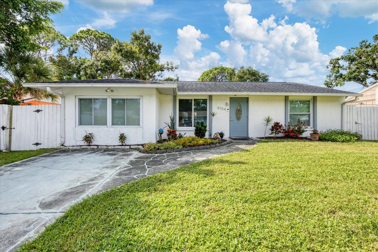 Fully remodeled and move-in ready! This charming one-story home offers comfort and style. Step inside to an inviting great room that flows into the large dining area. French doors with between-the-glass shades open to the patio and large back yard. Enjoy the modern kitchen, featuring ample storage in the beautiful cabinetry with expandable pantry, a double oven and a breakfast bar—perfect for casual dining or entertaining guests. The owner’s suite is a private retreat with two spacious closets and an ensuite bathroom complete with an updated vanity and sleek shower. Additional updates throughout the home ensure a fresh, modern feel in every room. Outside, enjoy a fully fenced yard—ideal for outdoor gatherings, pets, and there is room for a pool. No HOA, No CDD's and Not in flood zone! Conveniently located near beautiful beaches, shopping, and dining and walkable to school, this home truly has it all.