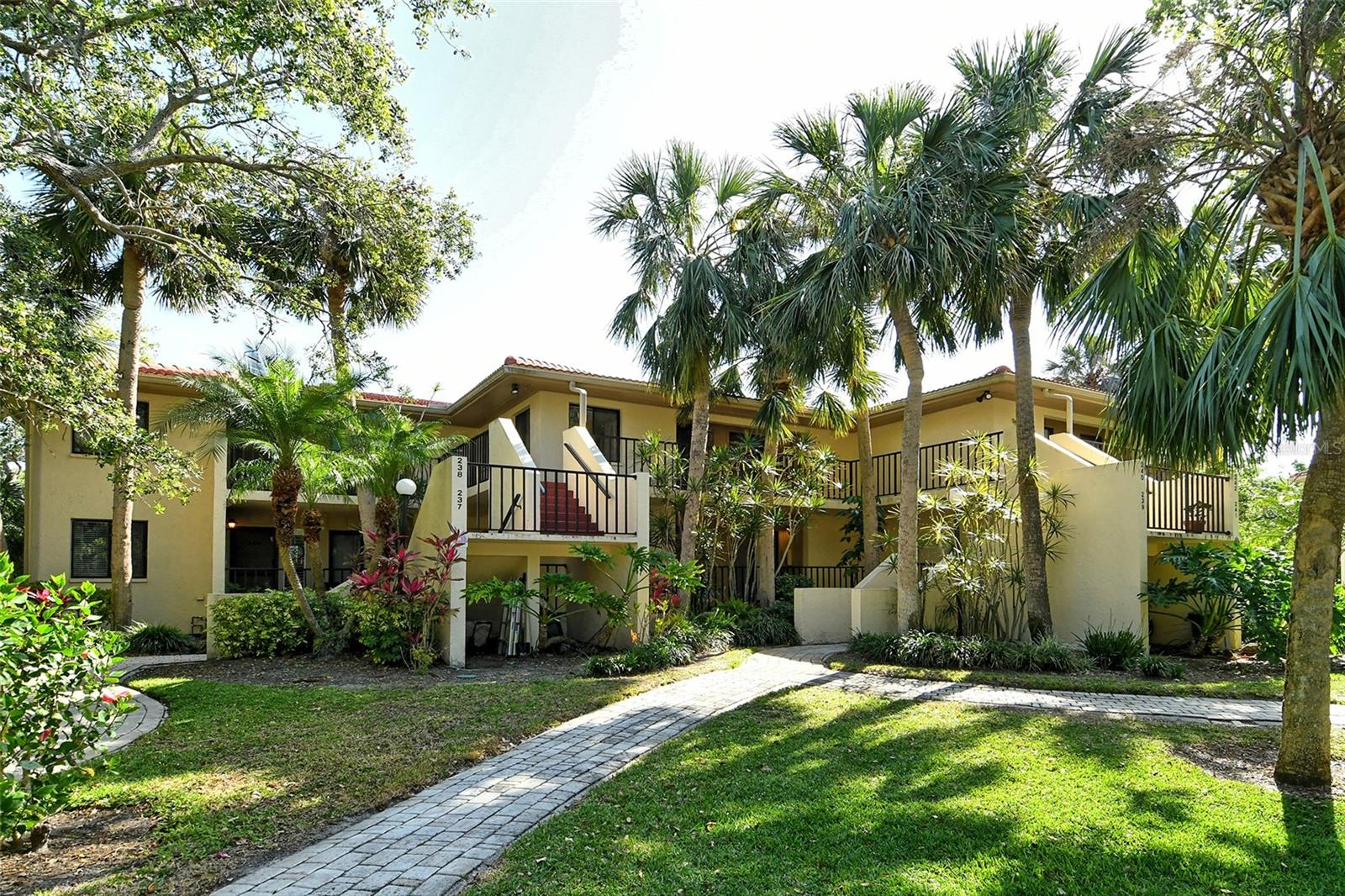 This Unit is less than 3 miles to IMG Academy. This is the Perfect Property to be close to students attending the Academy - and at the Perfect Price. Nestled in the heart of Wild Oak Bay, this generously sized second floor unit is located within Terrace II. This 48-unit section has 8-two story buildings built around a serene water feature. With a view of the tranquil pond, this home is surrounded by lush, tropical foliage and imposing Live Oak trees. Every room has a view of the peaceful natural surroundings. The Living/Dining Room has a wall of sliding glass doors opening to the over 19-foot x 11-foot covered and screen patio where there is plenty of room for outdoor dining and relaxing. Beyond the patio is an additional 19’x4’ open air private balcony with a 7’x3’ storage closet. The Primary Bedroom has sliding glass doors that also open the Patio and Balcony beyond. The bedroom includes a spacious 6.5’x6.5’ Walk-In Closet and an en-suite bathroom with walk-in shower. The Kitchen has a pass-through to the Living/Dining area to take in the natural beauty of the surroundings. With an eat-in breakfast area, closeted Washer/Dryer, and 3 large windows, the Kitchen is light, bright and inviting. The second bedroom has sliders opening to the front walkway, two closets, and is near the 2nd bathroom. Terrace II is a maintenance free community that includes a Community Pool, Spa and beautiful walking streets. Cable, Internet, Water, Sewer and Trash are included the quarterly maintenance fee. Wild Oaks is located close to IMG Academy, Bradenton Country Club, shopping, dining and Island Beaches. Don’t miss your little piece of paradise!