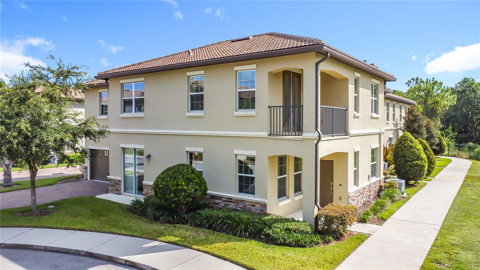 Located in the upscale gated community of The Vistas at Champions Gate, this stunning 5-bedroom, 3-bath townhome offers panoramic golf course views of the Greg Norman-designed course and Orlando’s Omni Resort, with no rear neighbors.
The open-concept floor plan features a bright living area, tile flooring throughout the main level, and a modern kitchen with stainless steel appliances. A first-floor bedroom and full bath provide flexible space for guests or multi-generational living.
Upstairs includes a spacious loft, three additional bedrooms, a full bath, and a laundry room. The primary suite features a private balcony with golf course views, double vanities, walk-in shower, and walk-in closet.
Additional features include a 2-car garage, wide driveway, and corner lot surrounded by natural landscaping.
Community amenities include access to a private clubhouse with heated pool, hot tub, sauna, fitness center, billiards room, and golf simulator. Residents also enjoy use of the Oasis Club with resort-style pool, lazy river, tiki bar, movie theater, and additional fitness center, plus the ChampionsGate Clubhouse with waterslide, pool, and mini golf.
HOA includes: Spectrum cable TV, high-speed internet, home phone, daily valet trash pickup, and landscaping.
Conveniently located near I-4, Hwy 27, and 192—just minutes from Disney, Universal, shopping, restaurants, and medical facilities.
Schedule your showing today.”