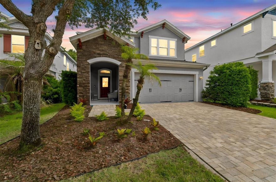 Tucked away in the private gated enclave of Bayberry Glen within Fish Hawk Ranch, this beautifully updated David Weekley Craftsman-style home offers one of the largest floorplans in the neighborhood along with exceptional indoor and outdoor living spaces designed for both entertaining and everyday comfort. Situated on a quiet cul-de-sac street with no rear neighbors, this home combines privacy, style, and functionality in one impressive package.

From the moment you arrive, the curb appeal shines with Craftsman architecture, stone detailing, and a brick paver driveway. Inside, you’ll immediately notice the upgraded finishes and spacious layout featuring updated luxury vinyl flooring throughout — absolutely no carpet anywhere in the home. The expansive living space is warm and inviting with custom stone accents and a beautifully designed entertainment wall that creates a true focal point for gathering and relaxing.

The gourmet kitchen is perfectly positioned at the center of the home and features granite countertops, 42” cabinetry, stainless steel appliances, custom lighting, a large center island, abundant prep space, and a walk-in pantry. Oversized windows across the rear of the home fill the living areas with natural light while showcasing views of the incredible outdoor entertaining space.

Step outside and discover what truly makes this home special — an oversized fully screened and pavered lanai designed for year-round Florida living. Complete with a custom pergola and granite countertop serving area, this outdoor retreat offers endless possibilities for entertaining, outdoor dining, watching the big game, or simply unwinding in your private backyard oasis.

The flexible floorplan includes a spacious first-floor bedroom and full bath ideal for guests, multigenerational living, or a private office setup. Upstairs, the oversized owner’s retreat features a luxurious en suite bath with dual vanities, garden tub, and a large walk-in closet. The second floor also includes a huge bonus room, additional flex/workstation space, and three generously sized secondary bedrooms with an updated guest bath.

Additional updates and features include a recently serviced A/C, new water heater, and a meticulously maintained interior and exterior.

Located in Hillsborough County’s award-winning resort-style community of Fish Hawk Ranch, residents enjoy access to pools, water park, fitness centers, pickleball, tennis courts, walking and biking trails, playgrounds, clubhouses, and top-rated schools including Bevis Elementary School, Randall Middle School, and Newsome High School.

Conveniently located near MacDill Air Force Base, shopping, dining, golf courses, and Florida’s beautiful beaches, this home offers the perfect combination of luxury, space, and the Florida lifestyle.
