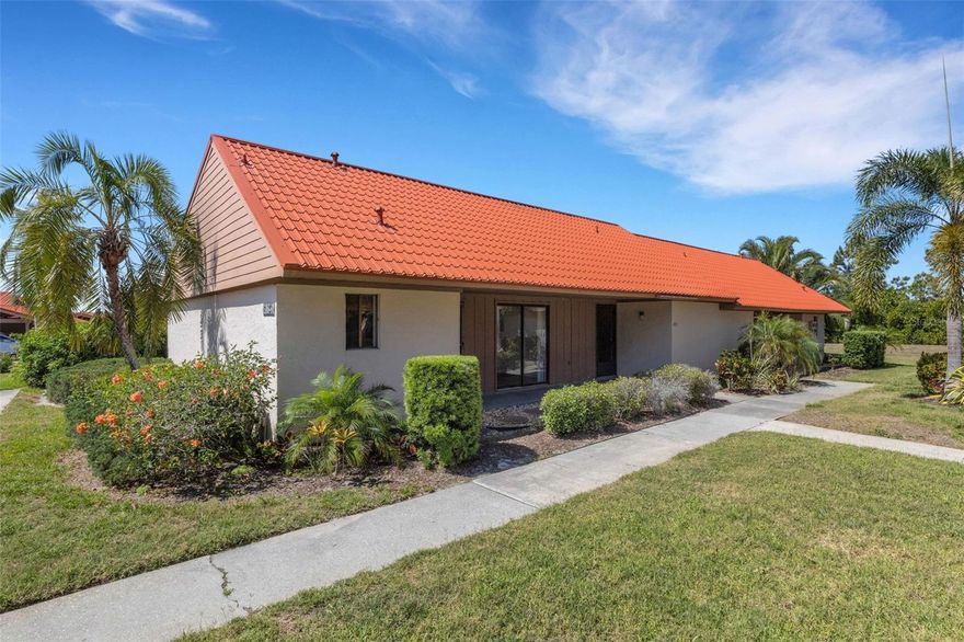 Welcome to Sunrise Golf Club! This attractive 2-bedroom, 2-bath condo located in the desirable Sunrise Golf Club community, offering an unbeatable location just minutes from world-famous Siesta Key. Beautifully positioned with peaceful, this light and bright residence features an open floor plan designed for comfortable Florida living. Expansive sliding glass doors invite an abundance of natural light inside, creating a warm and welcoming atmosphere throughout the home. The thoughtfully designed split-bedroom layout offers added privacy, making it ideal for owners and guests alike. The spacious primary suite includes a large walk-in closet and generous storage, while additional closets throughout the condo provide plenty of room for all your essentials. A full-size washer and dryer are conveniently located inside the unit for everyday ease. Enjoy the benefits of an updated metal roof, helping keep insurance costs low, along with affordable condo fees that add even more value. This unit also includes both a covered carport and assigned parking space. The private carport storage area is perfect for bikes, beach chairs, golf gear, and more. Residents of Sunrise Golf Club enjoy fantastic amenities including a heated community pool, tennis courts, and pickleball courts. Whether you're seeking a full-time residence, seasonal getaway, or investment opportunity, this prime location offers the best of Sarasota living.
