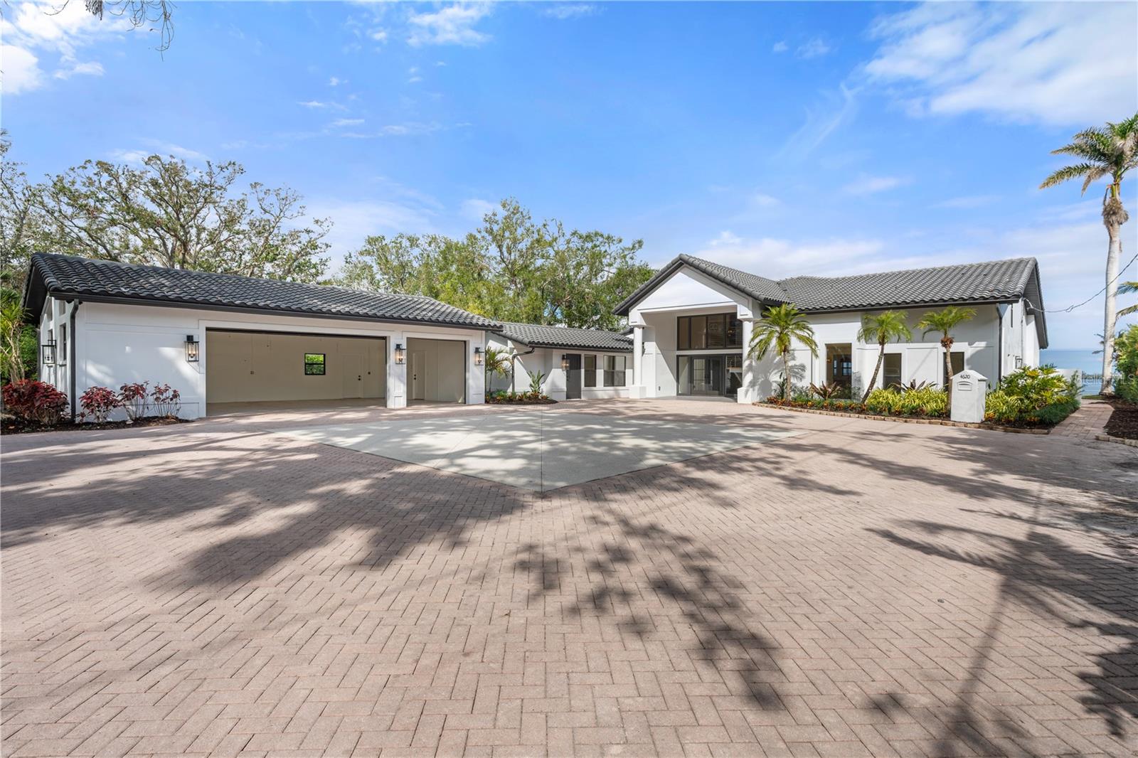 One or more photo(s) has been virtually staged. PRICED TO SELL: Get ready to fall in love with this completely renovated waterfront home—modern, fresh, and full of character! Located on a spacious acre along Bradenton’s sought-after Riverview Blvd, this 5-bedroom, 5-bathroom beauty blends mid-century charm with contemporary style, offering a lifestyle that’s both luxurious and laid-back.
As soon as you step inside, you'll be drawn to the bright, open-concept living spaces that capture incredible water views from almost every room. The gourmet kitchen is a chef's dream, featuring high-end appliances, custom cabinetry, and a huge island that's perfect for cooking or entertaining. And when it comes to storage, this home is a standout. In Florida, closet, pantry, and storage space can be hard to come by—but this home has it all, keeping things organized without sacrificing style.
The spacious primary suite feels like its own retreat, with sweeping water views, a spa-like en-suite bath, and direct access to the outdoor living area. Every additional bedroom offers the same comfort, with ample closet space and its own en-suite or semi-private bath—ideal for family and guests.
Need more space? This home offers an incredible 3-stall oversized garage with plenty of room for large vehicles, extra storage, or any other hobbies you might have. Whether you're parking oversized cars or storing outdoor gear, you’ll appreciate the added space and flexibility.
Step outside to your own backyard paradise. The large patio surrounds pool and hot tub, with plenty of room to add a custom grill or outdoor kitchen. The lot size is a rare find in this area, offering space for anything from a private pickle-ball court to the outdoor space you’ve always dreamed of. It's a huge park-like area perfect for hosting gatherings or simply enjoying quiet moments surrounded by lush greenery—and yes, a beautiful banyan tree adds to the charm. The privacy and potential are unreal.
For the water lovers, a new private dock is already in place and ready for customization, whether you enjoy sailing, jet skiing, or cruising the river. And the best part? The home sits high above the water, so flood insurance isn’t required, giving you peace of mind while you enjoy stunning views.
Other perks include an oversized laundry room, a convenient mudroom, and thoughtful touches throughout that maintain the home’s original charm while embracing modern-day living.
Just minutes from the shops, restaurants, and gorgeous beaches of Anna Maria Island (without the island traffic), this home truly offers the best of Florida living. Plus, you can get to all of it by boat, no traffic required.
Don’t miss out on this rare opportunity to own a piece of paradise on Florida’s Gulf Coast. Schedule your private showing today! Oh and great news, there is a separate entrance for a nanny quarters or mother-in-law suite. So convenient.
One or more photo(s) have been virtually staged.