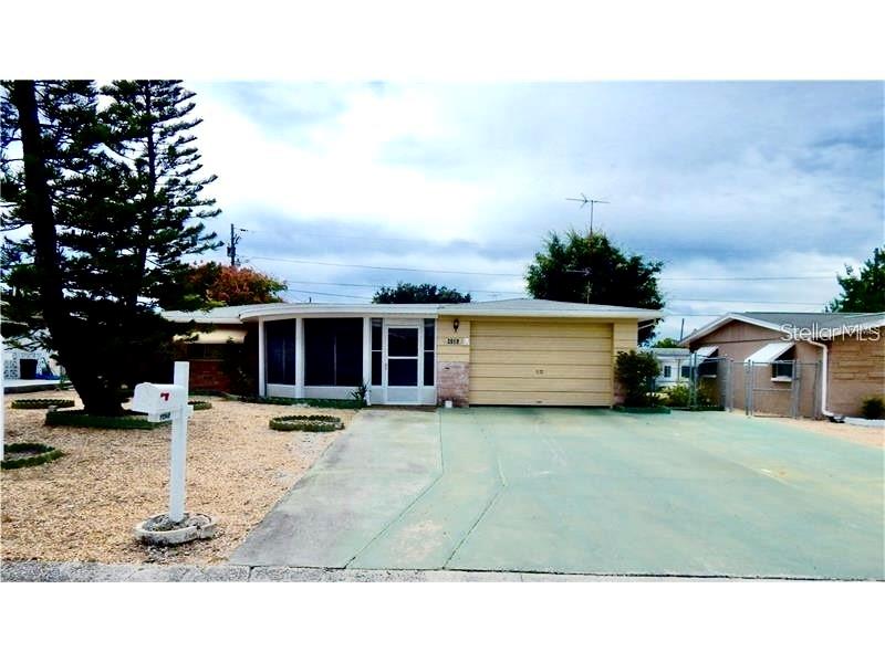 READY TO MOVE IN - SPACIOUS 2 BED W EASY 3RD BEDROOM PLUS A BONUS ROOM , 2 FULL BATHS , FENCED YARD , NO CARPET - HAS TERRAZZO AND VINYL , LARGE 1 CAR GAR (2ND BATH IS IN GARAGE W NEW TOILET) . 1300 SF PLUS LARGE FRONT PORCH.
