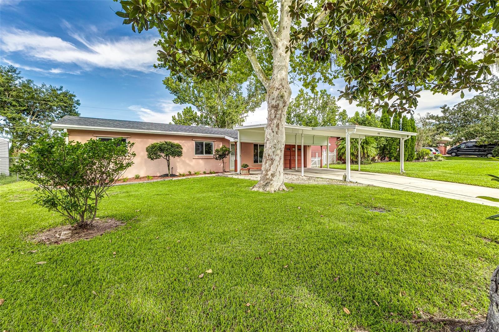 Refined and beautifully updated, this South Lakeland residence offers an elevated lifestyle with the tranquil charm of Little Banana Lake just beyond your door. Enjoy gorgeous sunset views from the fully remodeled sunroom, enhanced with elegant custom mitered trim—an ideal space for morning coffee or evening wine. The kitchen has been completely renovated, showcasing custom real wood cabinetry, newer stainless appliances, and designer lighting. Throughout the home, you’ll find fresh interior paint, newer double-pane windows, updated ceiling fans, and tasteful finishes at every turn. Both bathrooms feature newer cabinetry and shower doors, while the home's core systems have been meticulously updated with new plumbing, a new circuit breaker panel, a 2018 HVAC system, and a digital water heater. Outdoors, enjoy two storage sheds, hurricane shutters, leaf filter gutter guards, and a grill-ready outdoor area with power and hot water. The existing seawall offers the potential to add a private dock, expanding your access to peaceful lakeside living. With numerous renovations and upgrades already completed, this home is being sold 'as is', offering a move-in-ready experience with timeless style and modern function. Located near South Lakeland’s top-rated schools, dining, and boutiques—this is a rare opportunity to own a slice of waterfront elegance.
