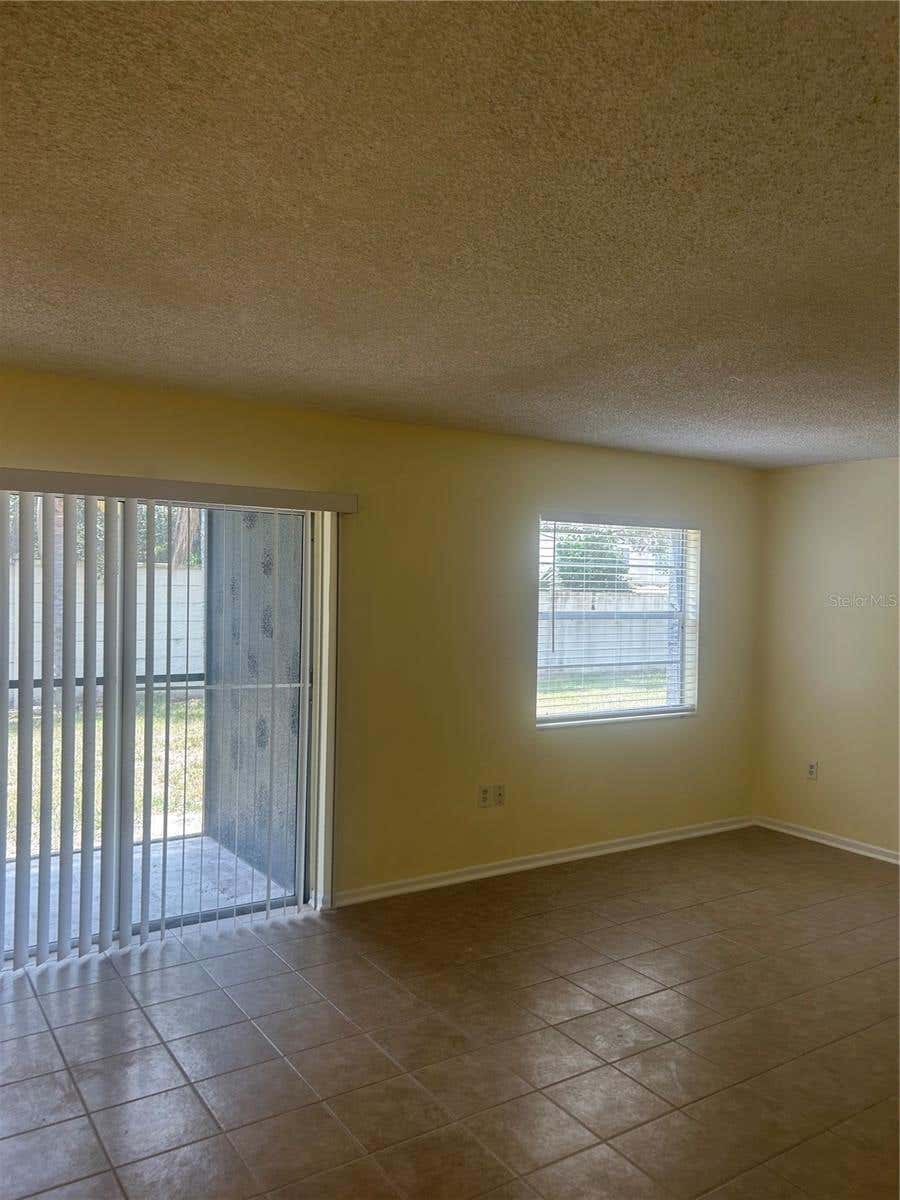Photo of 2513 N Alafaya Trail #21, Orlando, FL 32826 (MLS # O6429429)