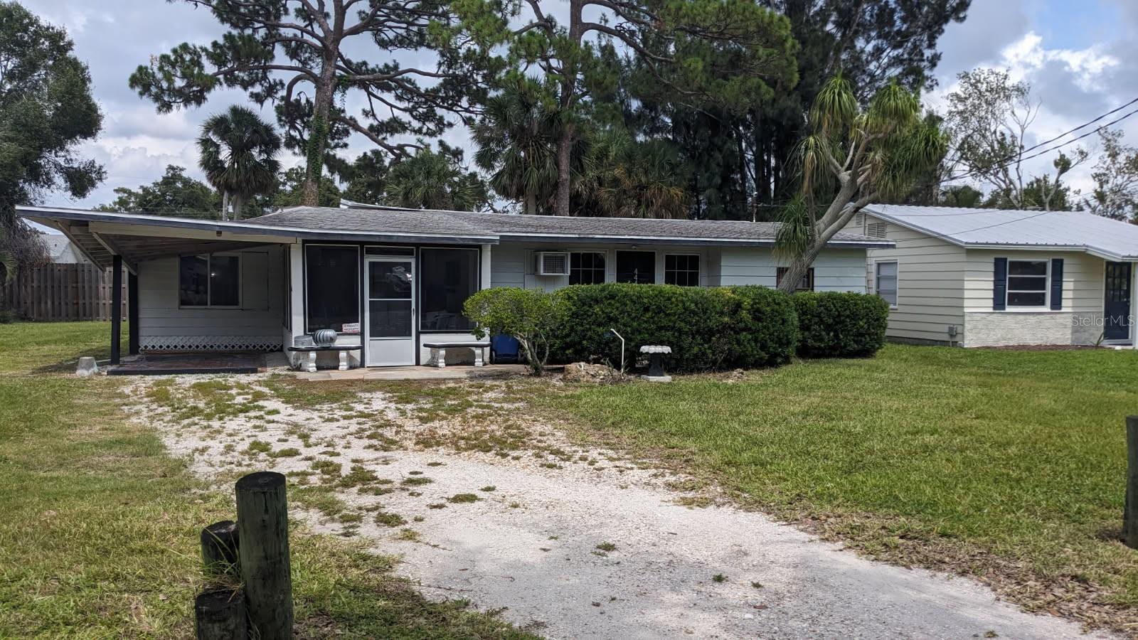 Under contract-accepting backup offers. Handyman or tear down. Potential of 2 buildable lots. The carport area roof lifted in last hurricane.