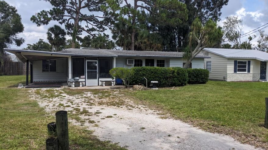 Handyman or tear down. Potential of 2 buildable lots. The carport area roof lifted in last hurricane.