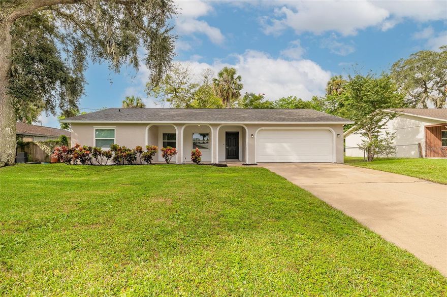 Welcome to this beautifully remodeled, move-in ready 3-bedroom, 2-bathroom home located in the heart of Ormond Beach. From the moment you arrive, you’ll be greeted by exceptional curb appeal and fresh new landscaping that sets the tone for what’s inside. Step through the front door into a bright, open floor plan featuring luxury vinyl flooring throughout and modern finishes that blend style and comfort. The spacious kitchen is a true showstopper, offering white shaker cabinets, stainless steel appliances, and gorgeous epoxy countertops—perfect for cooking, entertaining, and everyday living. Each bedroom is generously sized, and both bathrooms have been tastefully updated with contemporary touches. Enjoy peace of mind with all new windows and a new sliding glass door leading to the inviting back porch—ideal for savoring your morning coffee or unwinding in the afternoon breeze. Conveniently situated close to shopping, restaurants, the beach, the river, and more, this home offers the best of Ormond Beach living with nothing left to do but move in and enjoy. Roof 2024, HVAC 2024, and hot water heater 2025.