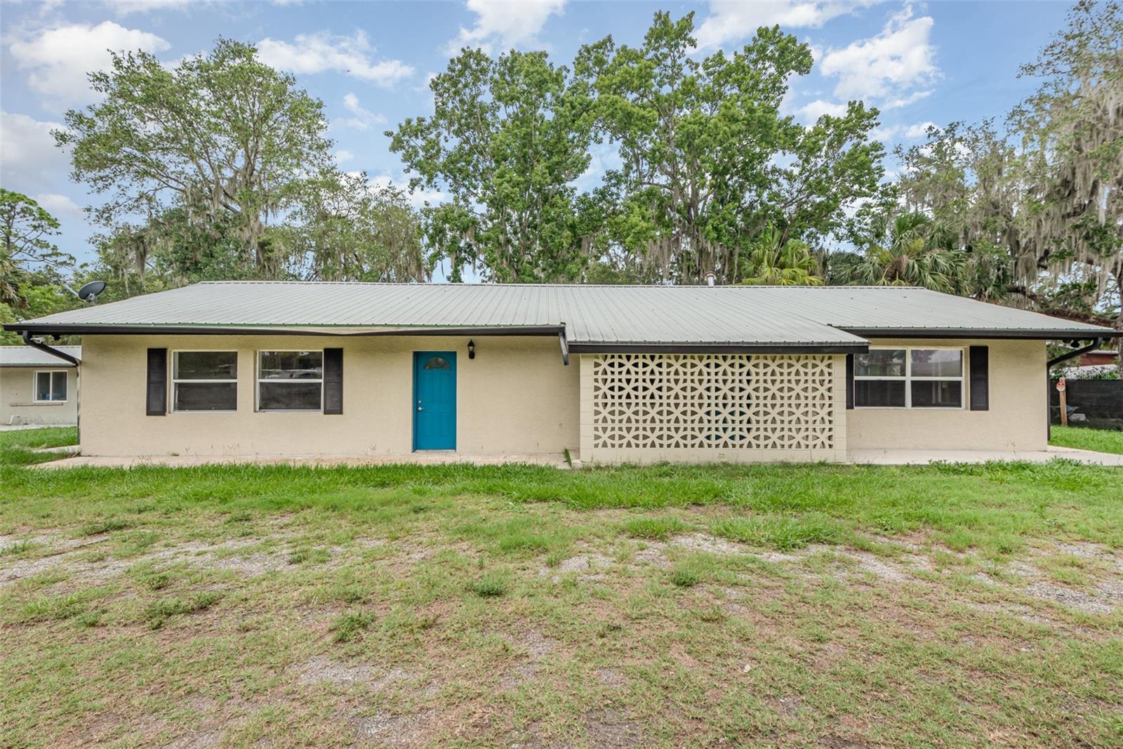fully renovated 4BR/2BA concrete block home featuring fresh paint, brand new A/C new well, updated light fixtures, tile & new LVP flooring throughout. Kitchen offers solid new wood cabinetry, butcher block counters, new stainless appliances, & breakfast bar. Both bathrooms have been fully remodeled. Home includes a metal roof, covered patio, 12x28' pump shed/storage building & a 26'x20' carport. Nestled on a bluff at the end of a paved road with no river flooding history. Enjoy abundant wildlife, deer, turkey & bald eagles. Short boat ride to Lake Harney, Monroe, Jesup, Deep Creek, & Mullet Lake Park. Ideal for boating, fishing, tubing & nature lovers. Minutes to public ramps, Gators Riverside, Jolly Gator & Hammock Restaurants. Peaceful, private setting with outdoor adventure just around the corner. Oviedo, Sanford, Lake Mary Osteen, & Mims is just down the road.