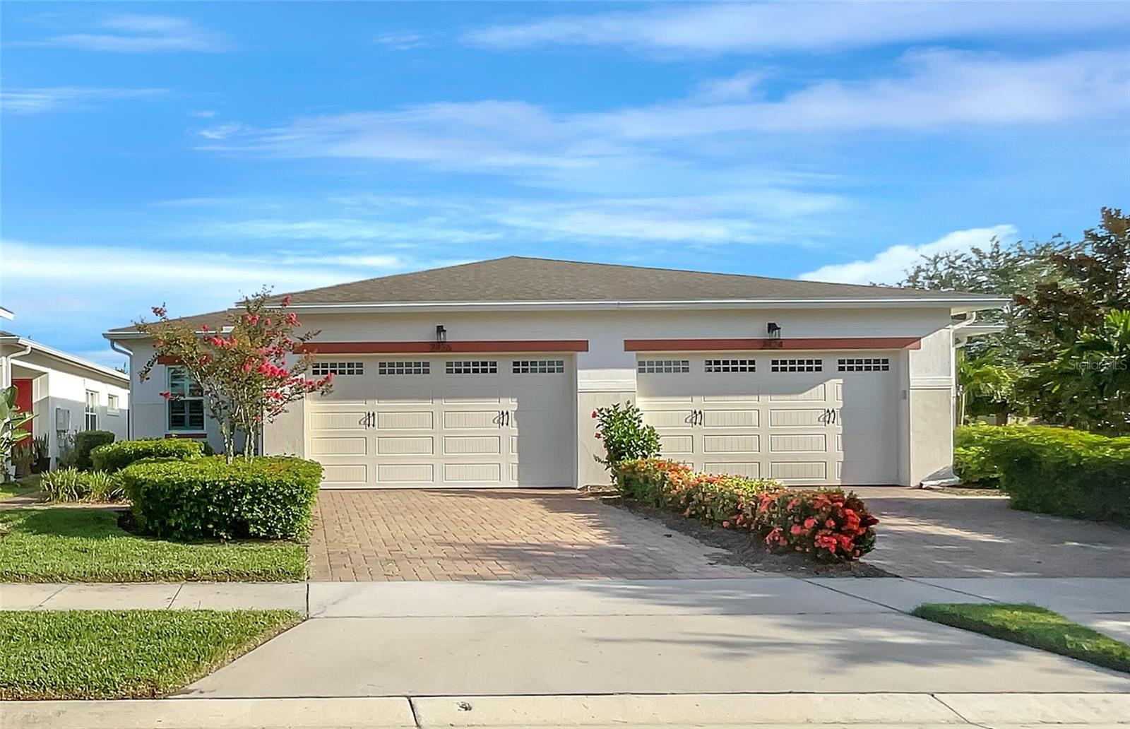 One or more photo(s) has been virtually staged. Welcome to this beautifully maintained 2-bedroom, 2-bath villa in the sought-after 55+ gated community of Del Webb Twin Lakes. Featuring an open and airy layout with high ceilings, plantation shutters, and tile floors, this home combines comfort and style. The gourmet kitchen offers granite counters, wood cabinetry, stainless appliances, pendant lighting, and a large island with sink and walk-in pantry. The spacious master suite includes a tray ceiling, walk-in closet, and ensuite bath with dual-sink granite vanity and tiled shower. A screened lanai, paver driveway, and parking for both car and golf cart add convenience.
Twin Lakes offers unparalleled amenities: three pools (resort-style, lap, and family-friendly), a 20,000 sq. ft. clubhouse with state-of-the-art fitness center, sauna, game rooms, and flex spaces, plus tennis, pickleball, bocce, putting green, and walking trails. Enjoy boating, fishing, or kayaking on Live Oak Lake with access to pontoon and jon boats. A full-time activities director ensures a vibrant calendar of events, from yoga to social gatherings.
Ideally located just minutes to shopping, dining, the Florida Turnpike, Lake Nona, and only about an hour to the beach. This home truly shines—schedule your private tour today!