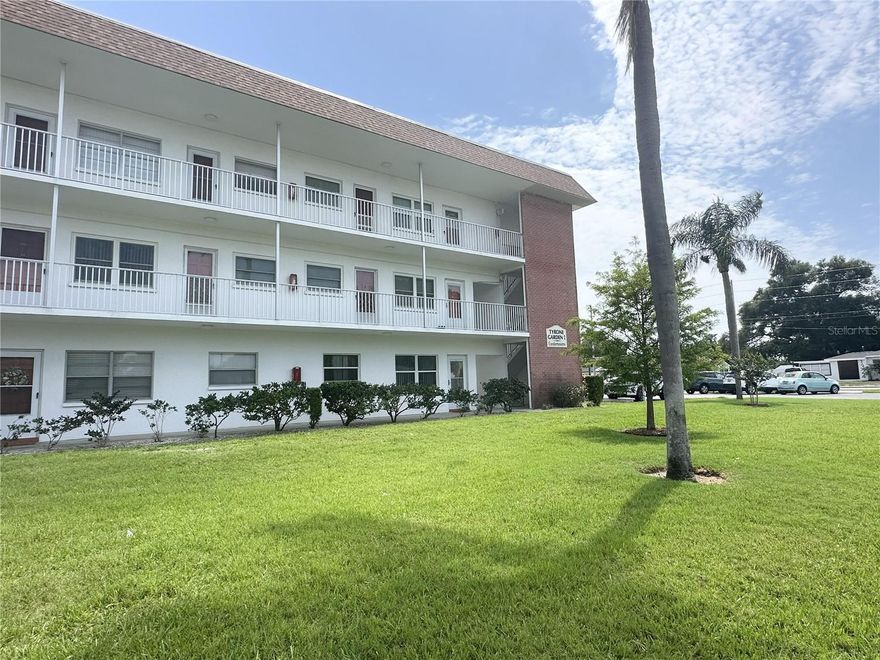 Welcome to this charming 2-bedroom, 2-bathroom condo nestled in an established, quiet Saint Petersburg neighborhood. This all-ages community offers a rare assigned covered parking space and beautifully manicured grounds filled with lush greenery. Inside, you'll find white kitchen cabinets and an easy-to-clean kitchen tile floor. The home also features a built-in desk with drawers, ideal for a home office, and a bonus room that can be customized as a family room, office, or guest space. Convenience is key with in-unit laundry (stackable washer and dryer), insulated windows, and extra private storage. The layout is perfect for roommates, with the second bedroom having its own exterior door. Enjoy the comfort of an elevator serviced building in a quiet, friendly complex. The condo is centrally located, just 10 minutes to Gulfport, 15 minutes to downtown St. Pete, and 15 minutes to the beach. Shopping and dining are within walking distance, and outdoor enthusiasts will love beautiful Northwest Park with walking trails, pickleball, tennis, a pool, and athletic fields. As an extra bonus, the seller is leaving 70 sq. ft. of tile for you to use in your space. This Tyrone Garden condo combines convenience, comfort and offers an easy living lifestyle.
