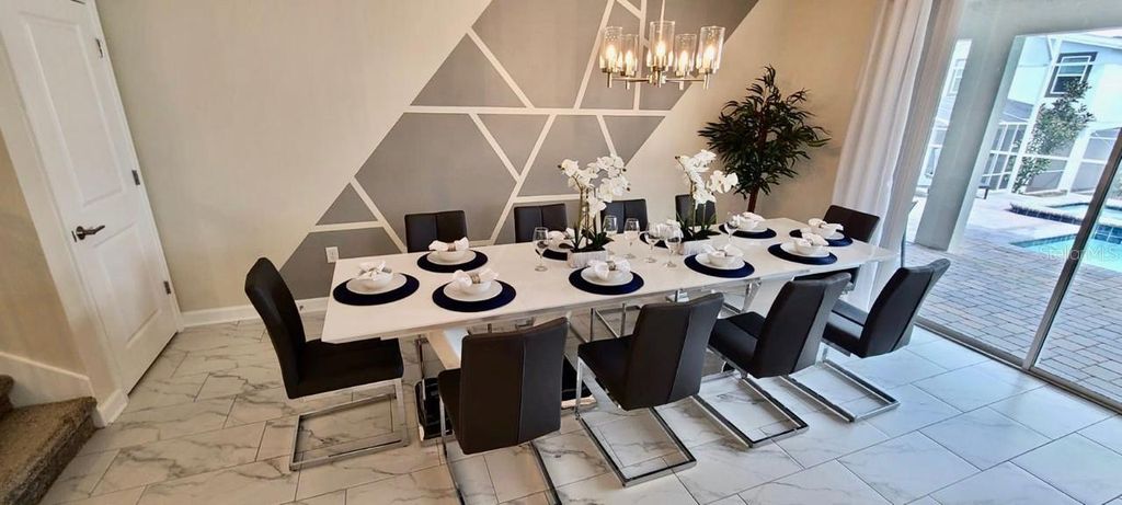 Photo of 1201 Challenge Drive, Davenport, FL 33896 (MLS # O6319610)