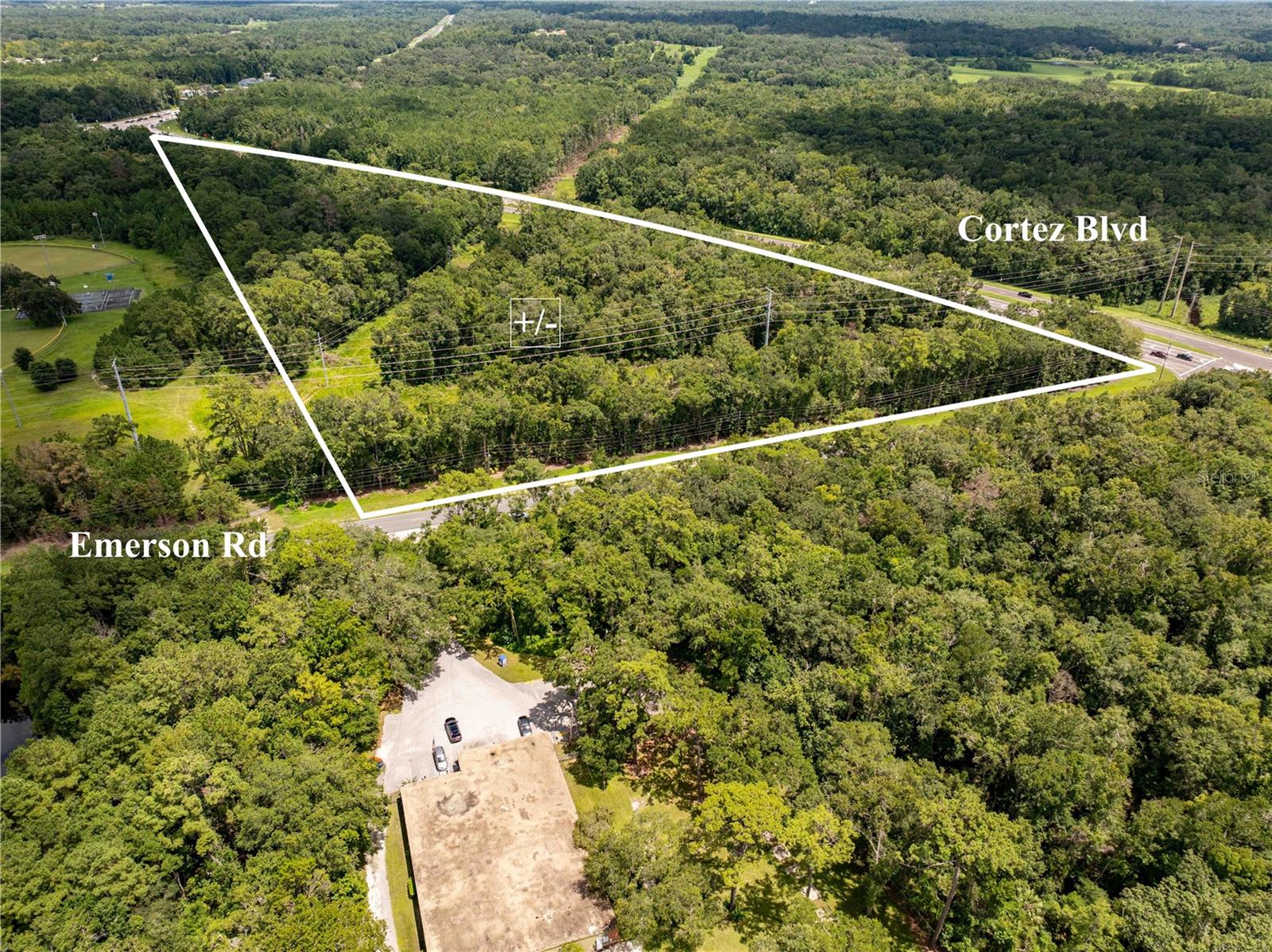Prime 18.7 acres of commercial land located on busy Hwy 50 (Cortez Blvd) at the signalized intersection of Emerson Road. With approximately 625 feet of highway frontage and an average daily traffic count of 23,500 vehicles, this property offers excellent visibility and exposure. Access is available from both Hwy 50 and Emerson Road with full turn lanes from north and south Emerson as well as a crossover, providing outstanding ingress and egress. The site benefits from being positioned at a traffic light, further enhancing accessibility. Powerline easements are in place, totaling 50 feet, with 25 feet on each side of the center of the tower. While no structures may be built within the easement, driveways, parking, and landscaping are permitted, giving flexibility for site design. This property presents an exceptional opportunity for commercial development in a high-traffic corridor.