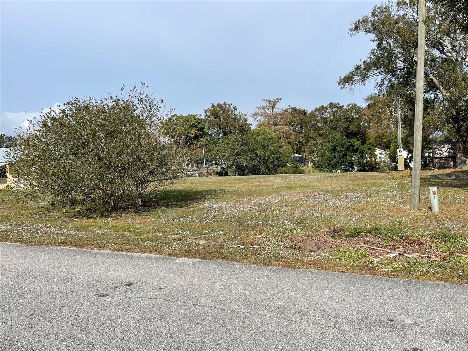TREASURE ISLAND. WATERFRONT LOT WITH LAKE OKEECHOBEE ACCESS. Ready for your custom home or manufactured home. Canal waterfront has access to Lake Okeechobee and both coasts. Lot is cleared and has city water and electric service is in place but disconnected. Seawall is in place but needs some work. Good canal with no fixed bridges. Same Seller owns the house next door (3837) which is also available for sale.