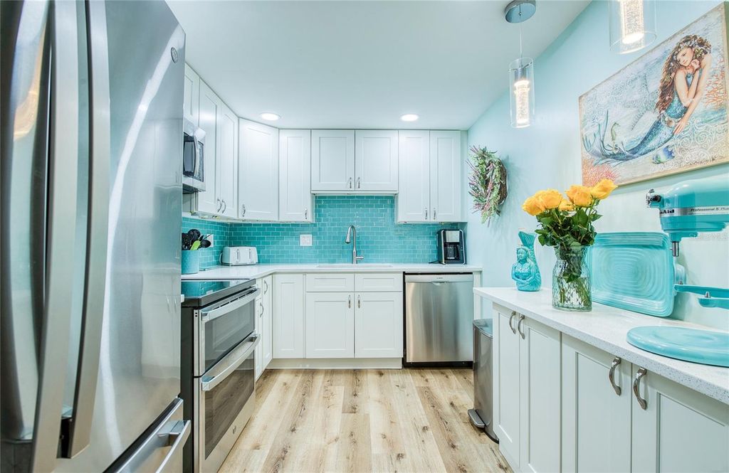 Photo of 10216 Regal Drive #310, Largo, FL 33774 (MLS # TB8474184)