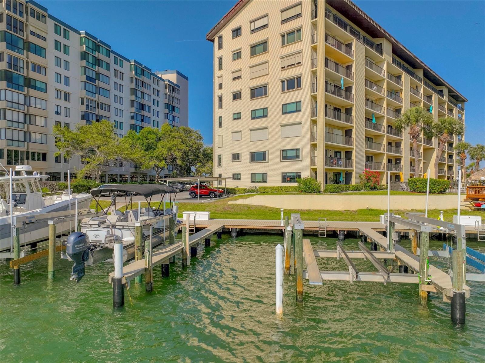 Welcome Home to Island Estates - Resort living at its finest. This light and bright 2 bedroom, 2 bath waterfront condo comes with its own deeded Boat Slip and private balcony, overlooking the crystal clear water perfect for viewing the gorgeous Florida sunsets. The master bedroom has a luxurious en-suite bath and large walk-in closet with balcony access. The second bedroom is perfect for guests or a home office. The chef’s kitchen boasts modern soft close cabinets with beautiful granite countertops and stainless appliances. The living room is spacious with water views. The building has brand new elevators, docks, siding and newer roof. Enjoy the many amenities of living in Island Estates including the Clearwater Marine Aquarium, Publix, several restaurants, park/playground, plus much more. Clearwater Beach is only a short drive/walk away, which was ranked one of the best Florida beaches, and has many nice restaurants and activities for your convenience. Don’t like this beautiful condo, slip away..
