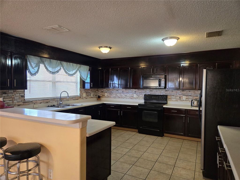 Photo of 4547 Ashtubula Court, Orlando, FL 32818 (MLS # O6353864)