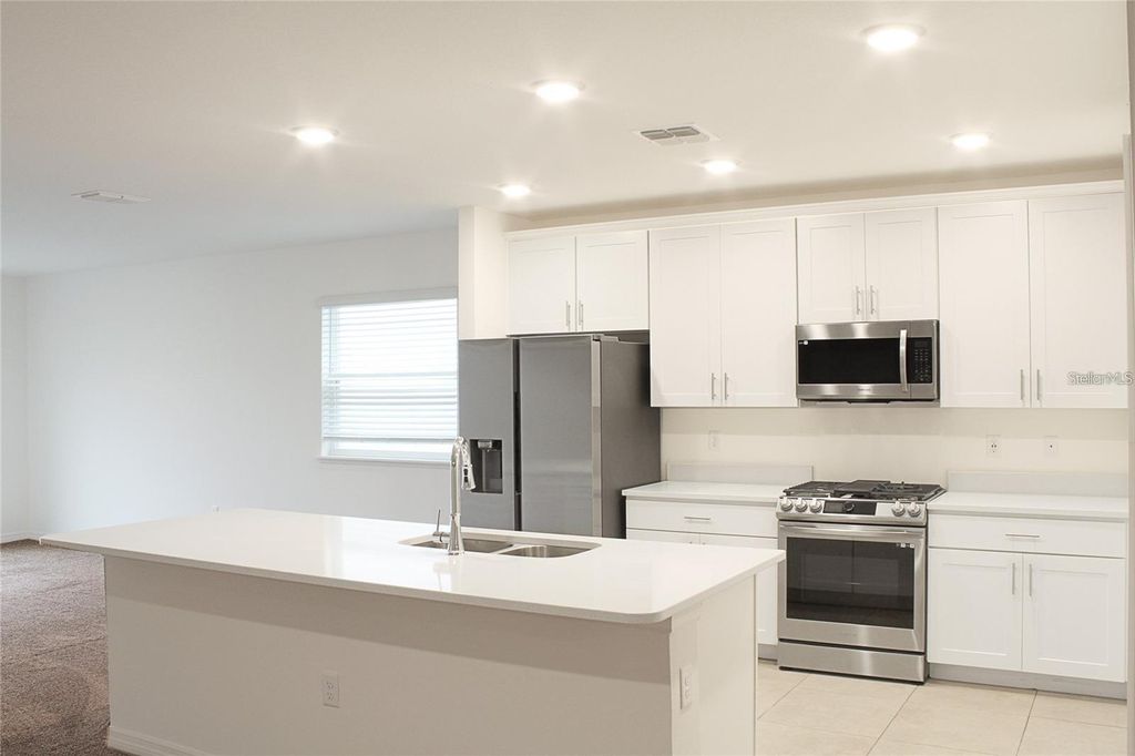 Photo of 1162 Oak Bluff Drive, Davenport, FL 33837 (MLS # O6422046)