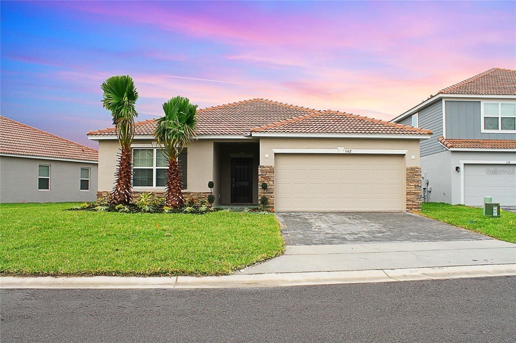 Photo of 1162 Oak Bluff Drive, Davenport, FL 33837 (MLS # O6422046)