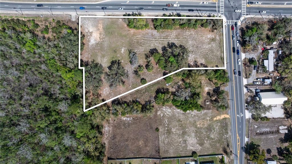 Photo of 711 Ronald Reagan Parkway, Davenport, FL 33837 (MLS # O6389516)