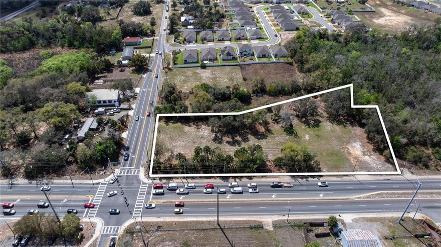 Signalized Corner Commercial Development Site | 1.92± Acres | Ronald Reagan Pkwy & CR 547

Rare opportunity to acquire a 1.92± acre signalized corner commercial assemblage in the rapidly expanding ChampionsGate / Davenport corridor.

Strategically positioned at the intersection of Ronald Reagan Parkway and County Road 547, the site offers approximately 441± feet of frontage on Ronald Reagan Parkway and 97.04± feet on County Road 547, providing excellent visibility, access, and strong traffic exposure.

Located within one of Central Florida’s most active growth corridors, the property is surrounded by significant residential development, tourism, and is within close proximity to Interstate 4, supporting continued commercial demand and long-term value.

The assemblage is well-suited for a variety of commercial development.

Additional upside: A neighboring 0.67± acre parcel is available for separate purchase, offering the potential to expand the footprint and enhance control of this prominent corner location.

Opportunities of this scale, frontage, and positioning are increasingly limited within the Davenport / ChampionsGate submarket.