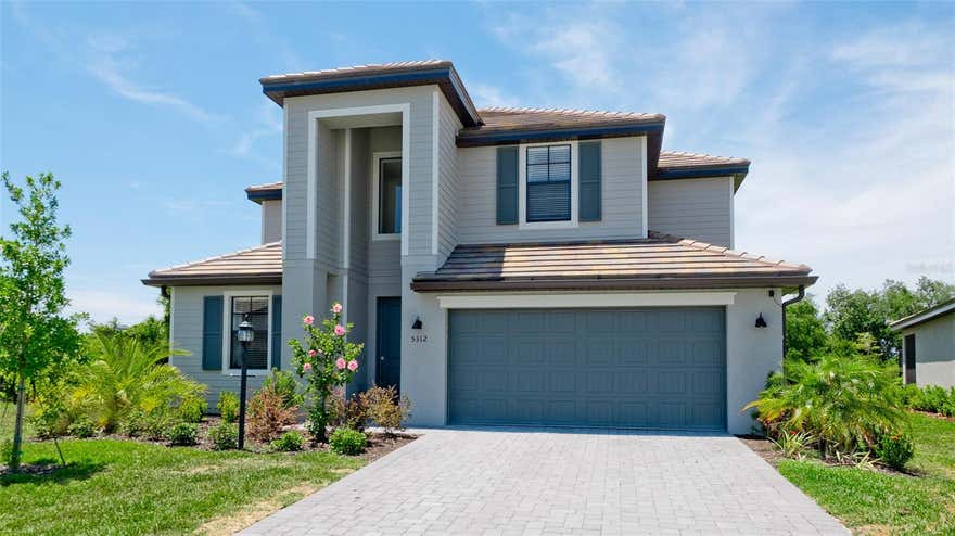 Welcome to this stunning two-story home situated on a premium private lot along a quiet cul-de-sac in the exclusive, guard-gated community of Lorraine Lakes in Lakewood Ranch. This spacious residence offers 5 bedrooms, 3 bathrooms, and a 3-car garage. The inviting open-concept design seamlessly connects a gourmet kitchen—featuring stainless steel appliances—to a bright breakfast nook and a generous great room. Flanking the dramatic two-story foyer are formal living and dining rooms, perfect for both daily living and entertaining. A guest bedroom and full bathroom complete the main level, which is beautifully finished with porcelain tile throughout. Upstairs, the luxurious owner’s suite boasts two walk-in closets, accompanied by three additional bedrooms, a large media room, and a spacious loft. Abundant natural light fills the home, enhancing its bright and airy feel. Outside, a screened lanai overlooks a fully fenced, expansive backyard, creating a private oasis ideal for relaxation and indoor-outdoor living. The home also features a 2-zone AC system for optimal comfort. Lorraine Lakes is a vibrant resort-style community offering exceptional amenities, including an on-site restaurant, a state-of-the-art fitness center, indoor and outdoor basketball courts, pickleball, tennis, bocce ball, volleyball, a playground, and a stunning resort-style pool with a poolside bar. Low HOA fees cover lawn maintenance, cable, and internet.
Conveniently located just a short drive from Sarasota, St. Petersburg, Tampa, Siesta Key, and Anna Maria Island, this home offers the perfect blend of luxury, recreation, and relaxed Florida living. Listing agent is the owner. Don’t miss this rare opportunity to own a beautifully designed home in one of the most sought-after communities in the area.
