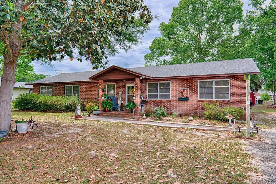 Welcome to this charming brick 3-bedroom, 2-bathroom home full of character and thoughtful features that are hard to find. The open layout connects the kitchen to the dining and living areas, making it a naturally warm and inviting space for everyday living and entertaining.
Stunning board and batten and cypress walls throughout the kitchen and living area give the home a distinctive, cozy feel that truly sets it apart. Generously sized bedrooms and bathrooms offer plenty of comfort, while cedar closets and built-in bathroom hampers add a level of practical elegance you will appreciate every day.
The home is set up with a chimney and brick floor ready for a wood burning stove, perfect for those cooler Florida evenings. A solar hot water heater keeps utility costs down, and the 12x12 storage barn provides excellent space for tools, hobbies, or extra storage. RV owners will love the dedicated electric hookup, and the partially fenced backyard gives you a great foundation to create your own outdoor oasis.
This one is full of charm, character, and functionality. Schedule your showing today!