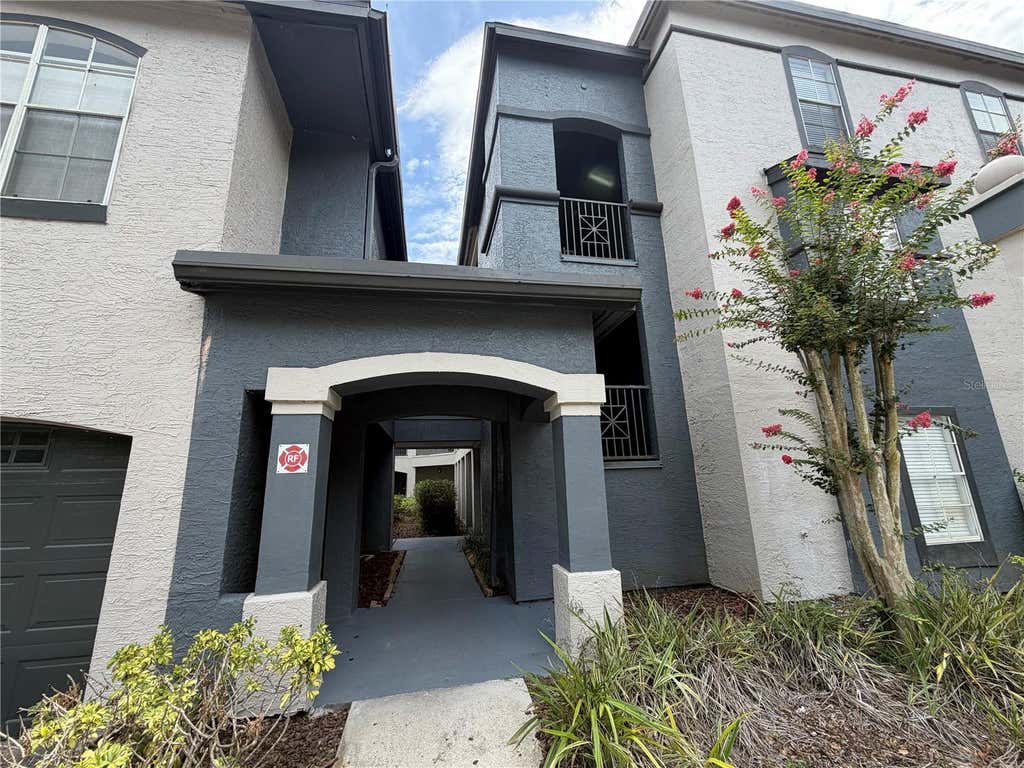 Photo of 13210 Arbor Isle Dr #102, Temple Terrace, FL 33637 (MLS # TB8534901)