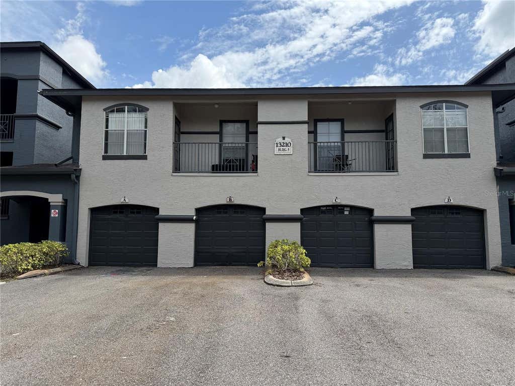 Photo of 13210 Arbor Isle Dr #102, Temple Terrace, FL 33637 (MLS # TB8534901)