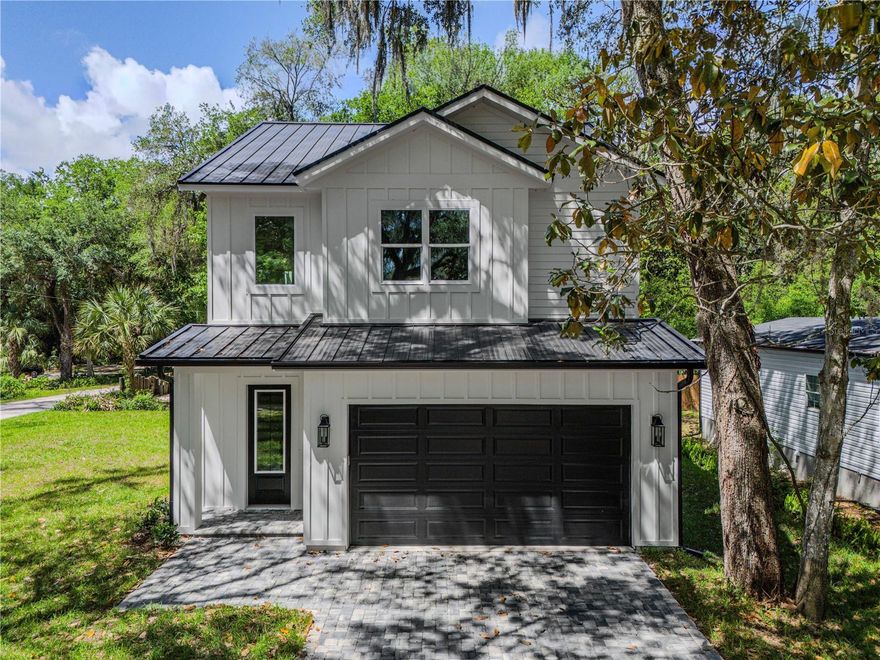 Beautiful new construction home in Palm Coast featuring charming cottage/coastal style on a desirable level corner lot. This thoughtfully designed residence offers 3 spacious bedrooms, 2 full bathrooms, and 1 convenient half bath, along with a 2-car garage. The functional layout is ideal for both everyday living and entertaining. Enjoy relaxing mornings on the inviting front porch and unwind in the evenings on the rear porch, creating great outdoor living spaces to enjoy year-round. Built with durable HardiPlank-type exterior siding, this home combines timeless curb appeal with low-maintenance living. Located in a growing area of Palm Coast, this brand-new home offers the perfect blend of style, comfort, and modern construction. A wonderful opportunity to own a move-in ready new build with quality finishes and coastal charm.