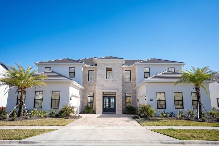 One or more photo(s) has been virtually staged. Introducing an extraordinary Toll Brothers lakefront masterpiece in the exclusive gated enclave of Laurel Pointe at Lake Nona.
Positioned on a premium waterfront homesite with a Northeast-facing front and a Southwest-facing backyard, this residence is perfectly oriented to capture soft morning light at the entrance and stunning afternoon sun over the lake, creating breathtaking golden-hour reflections across your future outdoor living space.
Spanning 6,632 square feet of contemporary elegance, this newly built estate showcases soaring ceilings, striking architectural lines, and an abundance of natural light throughout, with no carpet anywhere in the home. Every detail was curated for refined modern living.

Featuring 5 spacious bedrooms, a dedicated cabana bath ready for future pool enjoyment, and two private office spaces, one downstairs and one upstairs, this home was designed for today’s lifestyle. Whether managing business remotely, hosting executive meetings, or creating family memories, the layout offers both productivity and privacy.

The open-concept design flows seamlessly into a covered lanai overlooking serene lake views, where Southwest exposure enhances your afternoons with warm, inviting sunlight ideal for entertaining, relaxing, or designing the ultimate outdoor retreat.

At the heart of the home, the chef’s kitchen impresses with premium appliances, an oversized island, sleek custom cabinetry, and designer finishes, all opening to expansive dining and living areas that elevate both everyday living and large-scale gatherings.

The primary suite is a private sanctuary with tranquil water views and a spa-inspired bath featuring a freestanding soaking tub, oversized glass shower, dual vanities with smart mirrors, and curated luxury finishes.

Additional highlights include a private theater room for cinematic evenings, energy-efficient systems, dual 2-car garages, and generous storage throughout.

Located in Lake Nona’s innovative master-planned community, residents enjoy proximity to Medical City, USTA National Campus, Orlando International Airport, and premier dining and shopping, all within one of Central Florida’s most forward-thinking neighborhoods.
This is more than a home.
It’s a statement of lifestyle, design, and position.
Schedule your private showing today and experience elevated lakefront living at its finest.