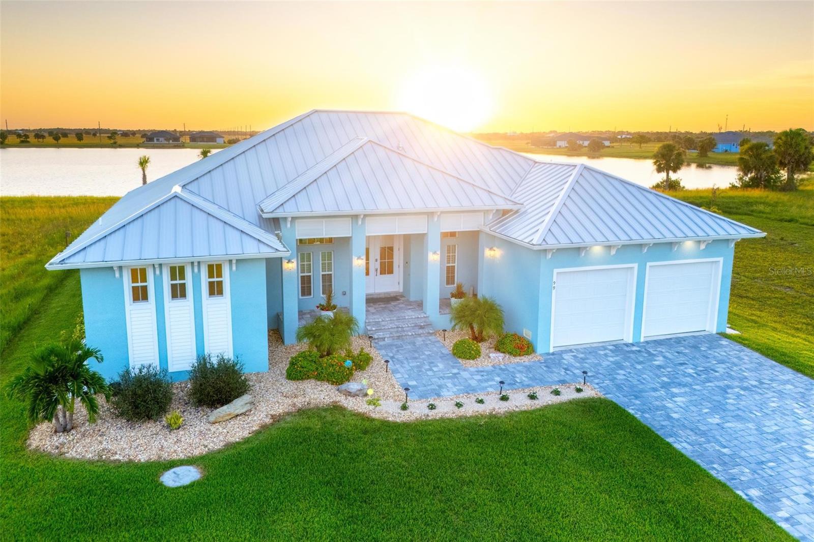 Imagine a tranquil estate with breathtaking lakefront sunset views, abundant land and privacy—and very close to Florida’s most beautiful and exclusive beaches, ample local golf courses, and nearby state-of-the-art full service marinas.
This pristine, virtually new custom home showcases an exquisite array of upgrades, from soaring coffered ceilings and a thoughtfully designed kitchen to a custom, artfully crafted pool and impeccably manicured landscaping, situated on nearly half an acre. The adjacent lot at 101 Wren is also available, offering the opportunity to expand your estate to nearly a full acre.
The floor plan is both practical and beautiful, with an open-concept great room and a den enclosed by French doors. The luxury kitchen features premium granite countertops, a walk-in pantry, soft-close cabinets and drawers, a wine refrigerator, and top-of-the-line smart appliances.
The primary suite is a luxurious retreat, complete with walk-in closets, a spa-like en suite bathroom, and a private sitting room/office with tranquil views of the pool and lake. Throughout the home, calming beach-inspired colors, plantation shutters, modern light fixtures, and high quality flooring create a serene and stylish atmosphere.
Enjoy peace of mind with impact windows, a Kevlar screen/sunshade for the lanai, a premium metal roof with spray foam insulation, a whole-house surge protector and generator-ready buried propane tank. The transferable flood insurance comes at a low rate due to the extra courses of stem wall, a foundational upgrade that speaks to the quality of this home from the ground up.
The heated saltwater pool features an oversized, deep spa, dual sunshelves, and comes with a warranty. The double-filtering air conditioning system is also under warranty. Additional features include a commercial-sized water heater, a whole-home water filtration system, and a garage door that can be controlled via smartphone.
Lush landscaping upgrades include premium grass and rows of palm trees that will grow to provide a tropical backdrop and enhanced lake views. The lake-fed irrigation system helps keep everything green with no added fees.
The 45-acre lake invites you to enjoy fishing, kayaking, and paddle boating, and county-approved private dock plans are available for your convenience.
Located in The Meadows of Placida, this uniquely peaceful neighborhood features expansive lots and million-dollar waterside homes. You're just ten minutes from the nearest Publix and a short drive to the world-renowned Boca Grande beaches and historic seaside town. Enjoy nearby Englewood, Manasota Key, Port Charlotte, and Venice for a variety of dining and shopping options, including fabulous waterside dining/restaurants. The local public boat ramps are less than 10 minutes away, where you can directly access the beautiful Gulf waters either by sail boat or power boat. A fishing and boating enthusiast will enjoy knowing this is the iconic Tarpon "Silver King" Capital of the World due to the deep waters, natural passes and inshore estuary.
Escape the hustle and bustle, and let the birdsong welcome you home to your private lakeside sanctuary.
