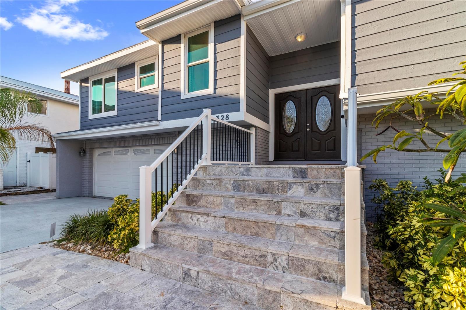 This is an extremely rare home, it has incredible water views from both the front and back of the home. It’s fully furnished and managed by a top-tier operator. It boasts a multiyear proven track record as a rental. It features a spectacularly remodeled, stunning chef’s kitchen featuring a 60” wide fridge, double sinks, a 48” dual fuel gas range and electric double ovens and a massive 13’ x 5.5’ island with bar seating for 7.
Positioned on a saltwater canal, the property features a heated pool and a dock equipped with both above and underwater lighting. The seawall has been recently updated, and the boat access has been newly dredged, complemented by a whole-home generator for added convenience.
Nestled on a quiet, dead-end street alongside other upscale residences, this home has a balanced blend of tranquility and accessibility, being just moments away from the beach, dining, nightlife, shopping, and a water park. Enjoy leisurely strolls to witness stunning sunsets or dine at nearby beachside restaurants. For the fishing enthusiast, cast a line off your dock or set sail to the Gulf, which is only minutes away via the Clearwater Inlet. This location is great for families of all ages seeking enjoyment.
Upon entry through the covered double doors, you are greeted by a marble-tiled foyer leading to a thoughtfully designed interior. The expansive 27-foot family room features a fireplace, built-in shelves, and panoramic water views, with double sliding doors on both sides of the fireplace, that open to a spacious balcony.
The kitchen showcases elegant, all wood shaker cabinetry, granite countertops, finished stainless steel appliances, a marble tile backsplash and ceramic tile flooring. Adjacent to the kitchen, the dining room is a part of the great room that has the kitchen, dining and family room, all has views of the intracoastal waters. Even the loft/breakfast area provides additional water views.
High end LVP waterproof flooring extends through the family room, hallway, and bedrooms, complemented by ceramic tiles in the kitchen and bathrooms. The master en-suite boasts a walk-in closet with French doors leading to a luxurious master bath, which includes a double vanity with granite countertops, a tiled walk-in shower with a glass enclosure, dual shower heads, a stained glass window, and a jacuzzi tub. The guest bath features a beautifully tiled walk-in shower with a glass door and a stylish vanity.
Downstairs, a generous 24'x16' bonus room with sliding glass doors opens to the pool and lanai area. The pool, heated and surrounded by elegant travertine pavers, overlooks the dock and waterway.
Additional features include a brand new Generac natural gas full house generator, brand new roof, a new gas pool heater, and a tankless gas water heater. The expansive backyard offers ample space for both covered and uncovered entertaining.
Numerous enhancements and upgrades to this home are too extensive to list. This property is a must-see! Your dream of Florida living awaits!.