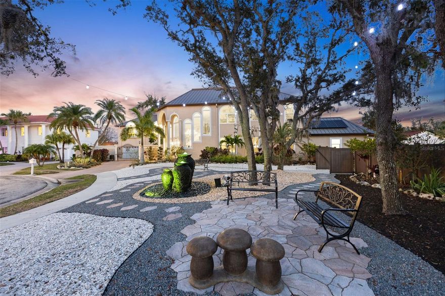 Massive Price Reduction! Where luxury meets the savvy buyer. An extraordinary opportunity where luxury, paradise, prestige, and privacy unite. With over $1.2 MILLION IN UPGRADES SINCE 2022, this remarkable estate delivers resort-style living, energy independence, and multigenerational flexibility in one of Clearwater’s most exclusive communities.

Set on 1.11 high-and-dry acres at the end of a quiet cul-de-sac within the private, 11-home gated neighborhood of Landmark Reserve, this home showcases the highest quality systems and finishes. A bronze GALVALUME STANDING SEAM METAL ROOF (2022), FULLY PAID 40.8 kW SOLAR SYSTEM WITH 125 SUNPOWER PANELS AND FIVE BATTERY BACKUPS, FIVE HVAC SYSTEMS (2022), and PREMIUM PGT HURRICANE-RATED IMPACT WINDOWS AND GARAGE DOORS ($350K UPGRADE IN 2023) ensure unmatched durability and efficiency. Energy bills average just $35/month, supported by a Level 2 EV charger, water softener, and private irrigation well.

Inside, elegance is expressed through HARDWOOD and MARBLE tile flooring, COFFERED ceilings, custom millwork, and a sweeping imperial staircase beneath a statement CRYSTAL chandelier. The gourmet kitchen is equipped with a WOLF 6-burner GAS cooktop, DUAL WOLF convection ovens, SUB-ZERO refrigerator (2023), SOLID SURFACE counters, oversized island, and custom cabinetry.

The main-floor primary suite offers spa-level luxury with a FRAMELESS WALK-IN shower featuring DUAL RAIN HEADS, soaking tub, double vanity, and direct outdoor access. A FULLY RENOVATED GUEST APARTMENT (2023) with its own kitchen, breakfast nook, living area, and laundry provides private space for guests, in-laws, or live-in support. Three ways to access the apartment. 

The outdoor setting is nothing short of a private resort: a HEATED SALTWATER POOL AND SPA (2023) with TRAVERTINE decking, SUN SHELF, LED lighting, water features, and a BOULDER ROCK FOUNTAIN. A TRANQUIL POND with a color-changing fountain is maintained by the HOA. The COVERED OUTDOOR KITCHEN (2023) features a natural stone bar, gas grill, wet bar, built-in seating, and a private pool bath.

An ADJACENT LOT IS INCLUDED, offering potential for an additional garage, guesthouse, or resale opportunity for a minimum 5,000 sq. ft. home.

Minutes from Clearwater Beach, Safety Harbor, Dunedin, airports, shopping, and fine dining, this estate offers an unmatched Florida lifestyle.

A rare chance to acquire a MODERN, TURN-KEY LUXURY ESTATE with CRAFTSMANSHIP, ENERGY EFFICIENCY, and PRIVACY at its core. Properties of this caliber are seldom available—act quickly to make it yours. Don’t miss this rare opportunity. Be sure to check out the stunning social media reel attached.