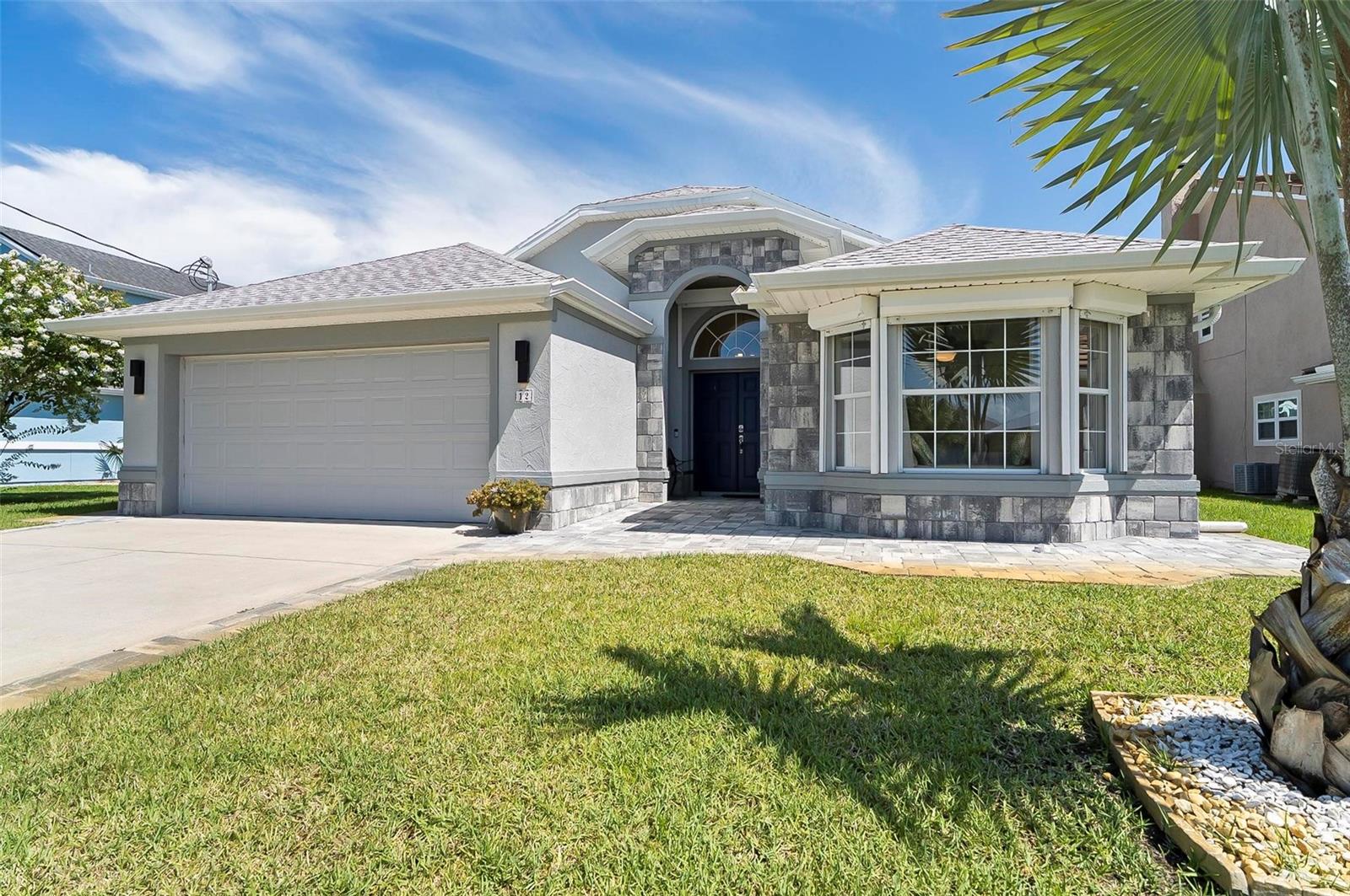 Welcome to this beautifully renovated saltwater canal and pool home, perfectly situated on a quiet cul-de-sac and designed for the ultimate coastal lifestyle. Inside, you’ll find stunning granite countertops with bar seating, sleek new stainless appliances, elegant tile flooring and crown molding throughout. The spacious great room is filled with natural light and features triple sliding doors that open seamlessly to the lanai and pool area that includes stainless steel charbroiled and travertine tile in the pool area—ideal for entertaining or relaxing by the summer kitchen. A brand-new dock includes a 10,000 lb. boat lift and dockside/shore power, making days on the water effortless. After your adventures, rinse off in the outdoor shower. Additional highlights include storm shutters on every window, a newer roof (7 years old), a resurfaced driveway (6 years ago), a new AC unit (2023), and a new sprinkler system (2024). You’ll also love the epoxy-coated garage floor, updated ceiling fans and light fixtures, custom blinds, and a stunning modern electric fireplace with stone surround.
This home is impeccably clean and truly move-in ready—there’s nothing left to do but enjoy. Don’t miss this rare opportunity to own a gorgeous canal-front retreat. View the virtual video for more details of this property and surrounding area.