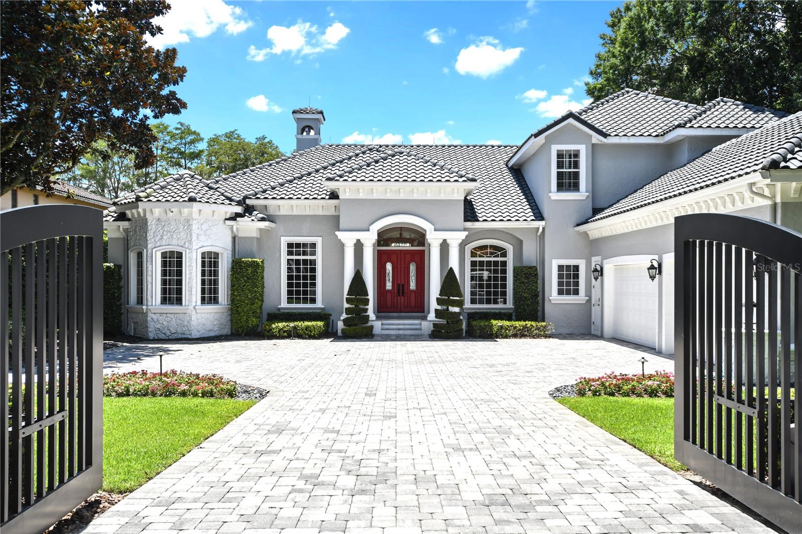 Welcome to 5000 Down Point Lane in Windermere, a luxurious retreat situated on 2 acres of pristine lakefront property. This entirely renovated home offers breathtaking sunsets over Sunset Bay, providing a picturesque backdrop for daily living.
The master suite, office, entertainment room and an additional suite are conveniently located on the main floor, while three more bedrooms and bonus room are upstairs. Cozy up by the fireplace in the spacious living area, or enjoy the elegance of Italian porcelain flooring throughout the home.
Outdoor living is elevated with a large pool patio and entertainment area, complete with a summer kitchen. The expansive grassy yard leads up to your private beach and dock, perfect for enjoying the best of lakefront living.
At just under 6,000 square feet, this home offers ample space for comfort and luxury. Don't miss the opportunity to own this spectacular property in Windermere.
