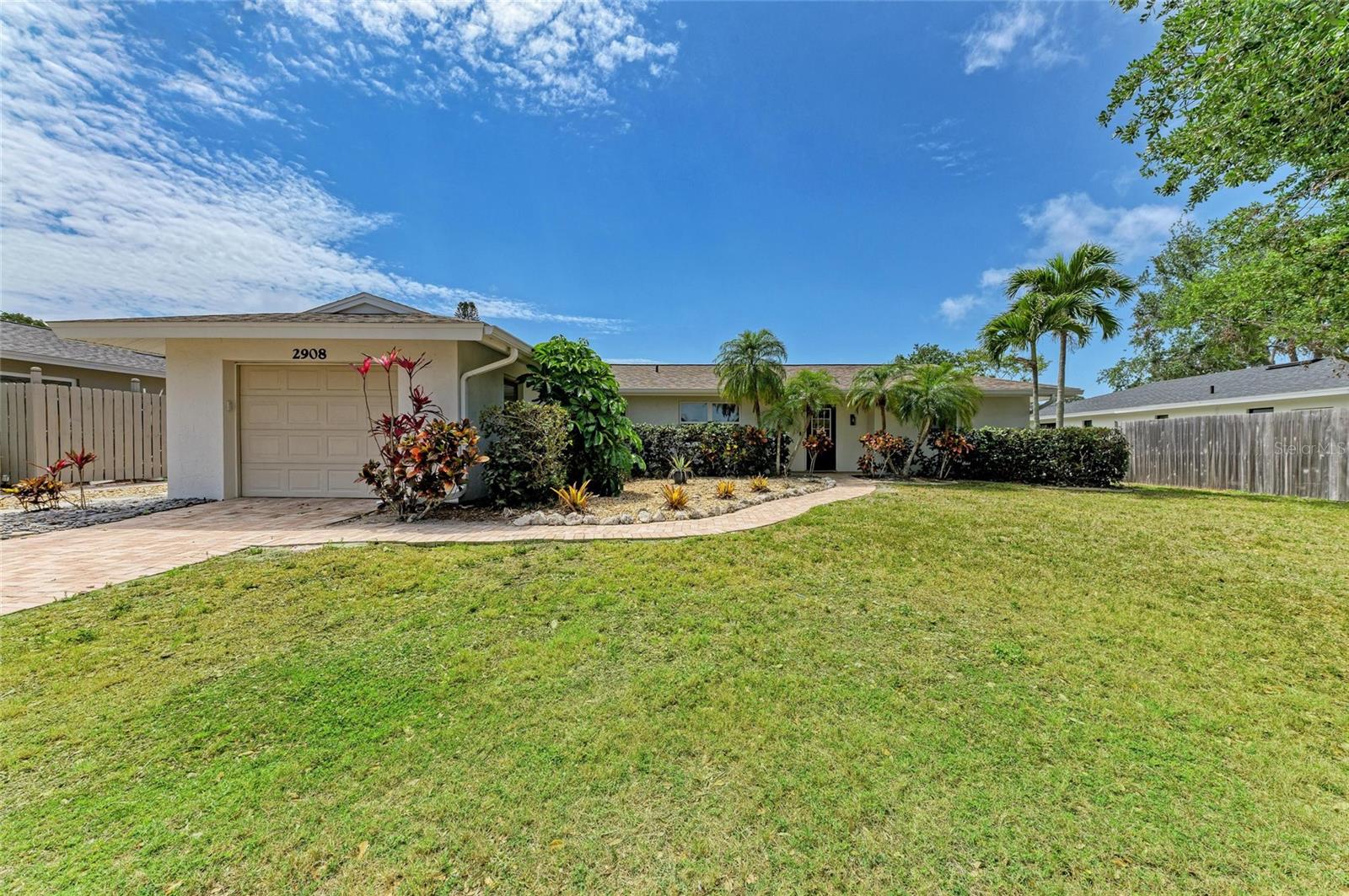 Welcome to this beautifully maintained and tastefully updated 3 bedroom, 2 bathroom home located in the highly sought-after Colonial Terrace neighborhood of Gulf Gate. Just a short walk to vibrant Gulf Gate Village and less than 3 miles from the world-renowned Siesta Key beaches, this home combines location, comfort, and peace of mind—with no HOA or CDD fees. Situated high and dry in Flood Zone X, this property sustained no damage or flooding from last year’s hurricanes, offering added security and reassurance. The roof was replaced in 2019, newer A/C, and the home features thermal pane hurricane-impact windows and doors for energy efficiency and storm protection. It has also been repiped with updated water supply lines, saving you time and money down the road. Inside, you’ll find stunning travertine flooring throughout, and a kitchen that’s both functional and stylish with concrete countertops and a hammered copper farmhouse sink. Two of the bedrooms are equipped with mini-split A/C systems for personalized comfort. Step outside into your private backyard retreat, where a tranquil heated pool and spa await. Both are PebbletTec lifetime finishes offering peace of mind from future resurfacing needs. The large screened-in lanai, fully fenced yard, and cozy fire pit make this the perfect space for entertaining or unwinding after a day at the beach. This property is zoned for Gulf Gate Elementary, Brookside Middle and Riverview High School. Whether you’re seeking a primary residence, vacation home, or investment property, this Gulf Gate gem is move-in ready and packed with valuable upgrades. Don’t miss this opportunity to own in one of Sarasota’s most desirable neighborhoods!