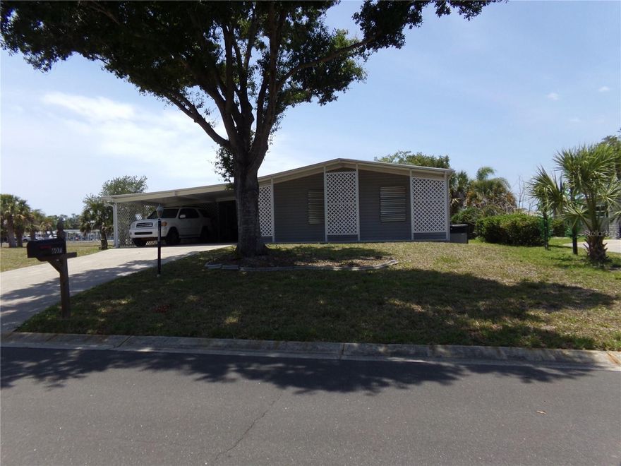 This beautiful 3 bed, 2 bath manufactured home offers peaceful canal views and comfortable Florida living.  Recent upgrades include new kitchen cabinets and appliances, newer windows, roof, plumbing, vapor barrier and hurricane shutters. Also included a convenient tankless water heater under kitchen sink.  Enjoy relaxing mornings or evening sunsets from the screened lanai with vinyl windows or the patio overlooking the canal.  The open and inviting layout makes this home perfect for seasonal or year-round living.  Located near to beaches, shopping, dining and local activities including the farmers market, art shows, and music festivals, this home combines convenience with a laid-back coastal lifestyle. Located in Lemon Bay Isles, this is a very active community offering the Lakeside Clubhouse with pool, tennis courts and many activities.