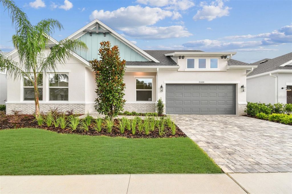 Photo of 31486 Hayman Loop, Wesley Chapel, FL 33545 (MLS # TB8414503)