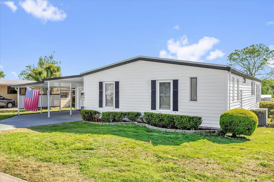 Gorgeous 2/2 On 18th Green/Fairway. Spectacular views from 27x18 Living Room and 12x17 Florida Room. Spacious floorplan ready for your personal touches. 2016 Membrane roof on Main Home plus 2021 Carport/Porch re-roof, 2014 A/C well-maintained. Newer windows in Living/Dining Area and vinyl all-season windows in the Florida Room. Desirable Double Carport and Golf Cart Garage/Storage. Tons of cabinet space in the Kitchen and Inside Laundry. GOLF CART & PATIO FURNITURE CONVEY WITH FULL PRICE CONTRACT.  Extra Refrigerator conveys. Located in Prestigious 55 Plus Zellwood Station Golfing Community. More amenities and activities than you can fit into your busy lifestyle. Close to shopping, restaurants, airports, beaches, places of worship, theme parks. 4 Pools, Pickleball, Tennis, Shuffleboard, Bingo, Trivia, Cornhole, Stained Glass, Ceramics, Exercise. Woodshop, RV Parking, FULL SERVICE RESTURANT/BAR ON SITE, 18 Hole Gold Course with Reduced Greens Fees for Shareholders. (washer does not convey)