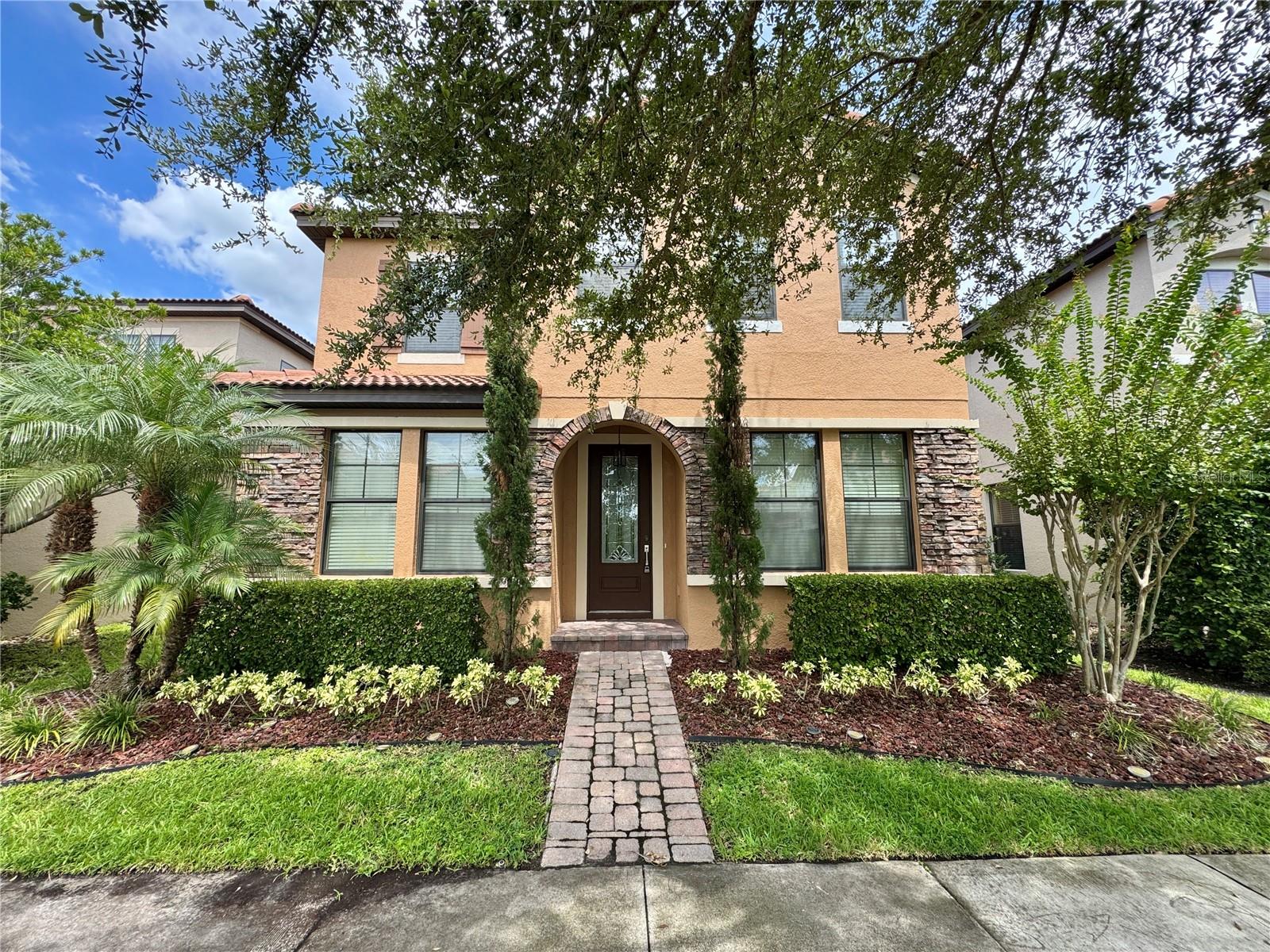 Discover this beautiful Mediterranean-style two-story home in the gated community of Wesmere, off Maguire Road in Ocoee, Florida. Featuring 4 bedrooms and 2.5 bathrooms, this home offers an open, light-filled layout with tile flooring throughout the first floor. The spacious living area includes a versatile dining space, a bar area outside the kitchen perfect for entertaining, and a half bath with a modern vanity and LED-lit mirror. The kitchen has large cabinets, sleek countertops, energy-efficient stainless steel appliances, and a cozy breakfast nook overlooking the fenced backyard—ideal for pets and gatherings. Notably, there’s no carpet throughout the home for easy maintenance.
Upstairs, enjoy a luxurious master retreat with an en suite bath featuring a soaking tub, glass shower, and double vanities. Three additional bedrooms share a second full bathroom with a double vanity and sliding shower. The home is energy-efficient and includes an upstairs laundry room for added convenience.
Community amenities include a large pool, playground, and clubhouse. Conveniently located near Westbrook Elementary, Publix, shops, restaurants, major highways, Disney Parks, Winter Garden Village, and Downtown Windermere. Exterior features include stone facades, a rear-facing garage, tile roofs, and paver driveways.
Don’t miss this opportunity—schedule a showing today!