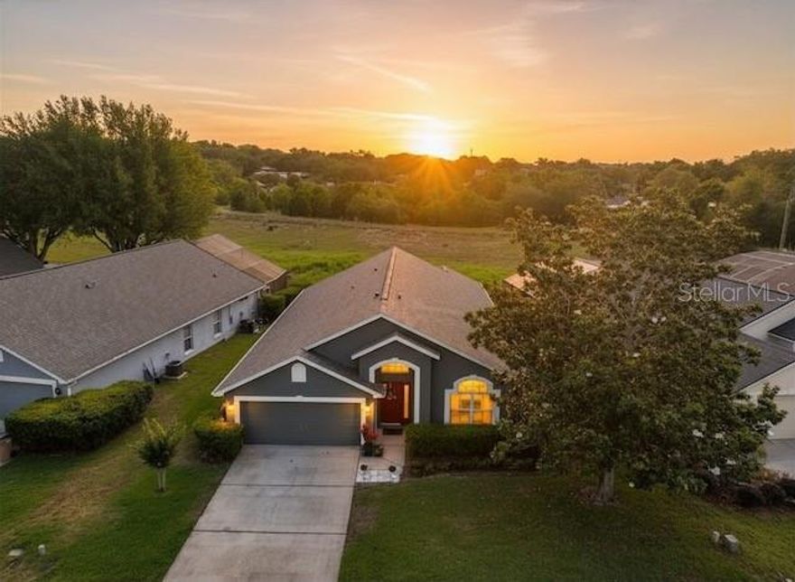 This inviting & well maintained single-story home with No Rear Neighbors offers 3 bedrooms plus an office/nursery/exercise room attached to Master Suite - or 4th bedroom. 2 baths, and 1,939 square feet of well-designed living space. New Roof 2025!!! New A/C ’21, Painted inside & out ’22. Move-in condition! Guard Gated Lake front Community only 15 Minutes to Downtown Winter Garden.  

Step inside to a welcoming great room with vaulted ceilings and abundant natural light, creating an open, airy feel from the moment you enter. The kitchen & dining area flow seamlessly into this space, making it ideal for everyday living & easy entertaining. The kitchen features rich granite countertops, stainless steel appliances, a center island, plantation shutters, and a convenient built-in desk.

The spacious primary suite includes a walk-in closet and versatile bonus room currently used as a sitting area. With it's own closet, this bonus room can easily be transformed into a 4th bedroom if desired. It is also perfectly situated for a home office, private den, exercise room, hobby/crafts or nursery. The primary bath offers dual vanities, relaxing garden tub, & a large walk-in shower. 2 additional bedrooms and a guest bath provide plenty of room for family or visitors. Step outside to the screened-in lanai & enjoy serene sunrise views from the east-facing porch and backyard. Sip your morning coffee while watching the first light of day over the open green space, knowing you have no rear neighbors to interrupt the peaceful setting. This tranquil outdoor retreat truly extends your living space and makes the most of the beautiful surroundings. Magnolia Pointe is an "amenity-rich" destination where every day feels like a vacation. Residents enjoy exclusive access to: • Johns Lake Access: Launch your boat from the private community ramp and pier into 2,500 acres of world-class bass fishing and water sports. • Resort Living: Take a dip in the sparkling community pool, stay active on the tennis, & basketball courts, or enjoy the fitness center & clubhouse. Explore manicured walking and biking trails, multiple playgrounds, and a dedicated dog park for your four-legged friends. Historic Downtown Clermont hosts the beloved Sunday Farmers Market, monthly Wine Strolls, and major annual festivals like Pig on the Pond, the Sips and Salsa Festival, and the Enchanted Forest of Trees. • Active Outdoors: Proximity to the South Lake Trail and Waterfront Park provides endless opportunities for cyclists, triathletes and casual strollers alike. The bike trail connects for miles and extends to Winter Garden and many miles beyond. Unbeatable Location & Shopping. Convenience is key at Magnolia Pointe. Positioned perfectly off Highway 50 with easy access to Florida Turnpike: • Everyday Essentials: Minutes from Costco, Target, Kohl’s, and a variety of grocery options. • Dining & Entertainment: Explore the local flavors at the Montrose Street Market, grab a craft beer at Suncreek Brewery, or enjoy waterfront dining at the Tiki Bar & Grill on Lake Minneola. • Commuter Friendly: A straight shot to Winter Garden Village, Downtown Orlando, and the world-famous theme parks.  Magnolia Pointe isn’t just a neighborhood; it’s a lifestyle destination. Whether you're reeling in a prize bass on Johns Lake or enjoying a sunset stroll through your secure, gated sanctuary, you’ve finally found home.*Room sizes approximate. Buyer to verify all information in this listing.