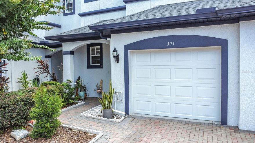 Welcome to this beautifully maintained home in a peaceful neighborhood just minutes from top dining, shopping, and attractions. The first floor features stylish grey wood-look tile throughout, complementing the open-concept layout that flows from the living and dining areas into the kitchen. The kitchen boasts granite countertops, stainless steel appliances, abundant cabinetry, and a spacious island—ideal for entertaining. Upstairs, the primary suite offers two walk-in closets with custom shelving and a private ensuite with dual granite vanities and a walk-in shower. Two additional bedrooms share a modern full bath. Recent updates include a new roof (2023), carpet in secondary bedrooms, garage door opener (2021), garbage disposal (2021), and extended tile flooring (2021). Washer, dryer, and garage shelving convey. With thoughtful upgrades, ample storage, and a prime location, this move-in ready home is a must-see!