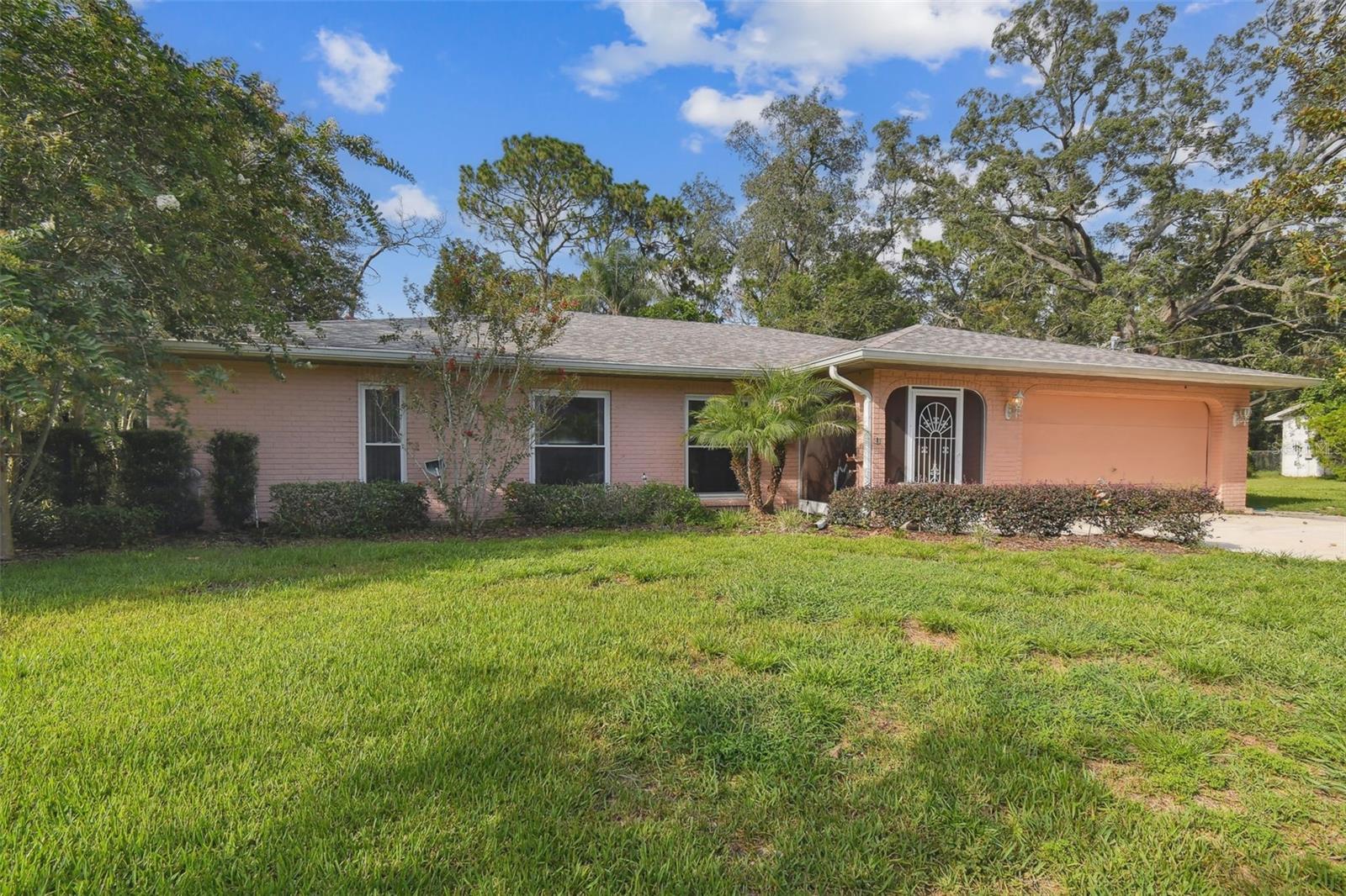 Come see this spacious pool home on .23 acres in an established neighborhood with a NEW roof (50-year shingles). Your Florida outdoor living is enhanced by a resurfaced heated pool, lanai with pavers, and a covered deck ideal for dining and entertaining. Recent mechanical improvements include a Hayward pool pump and SunBlazer pool heater. The fully fenced yard ensures privacy with no rear neighbors, except for foliage, and houses a shed for added storage. Plenty of living space for everyone… the open-concept design seamlessly connects the kitchen, breakfast area, and family room, while traditional living and dining rooms provide additional flexibility. New luxury plank flooring elevates all formal living spaces. A split floor plan provides privacy for the primary suite, and the secondary bedrooms are large enough for queen beds and furniture. The primary suite features a large walk-in closet, ensuite bath with a tub and shower combination, and direct access to the rear deck. The kitchen is equipped with custom cabinetry, multiple pull-out features, a farmhouse sink, and updated appliances, including a Whirlpool dishwasher (2025), Whirlpool refrigerator (2024), and GE Profile microwave (2021). Garage has been converted, but removal of the partition wall will convert it back to a 2-car garage. NO HOA. NO CDD. NO flood insurance required. This home comes with hurricane shutters for your safety. Come see how you can make this home your own today! Hernando County is situated in the heart of FLORIDA'S NATURE COAST, with acres and acres of State forests, and public access to rivers, lakes, and the Gulf. In less than an hour, you can be in downtown Tampa, Tampa International Airport, or cruise up Highway 19 to the beautiful town of Crystal River, home of the manatees and natural springs…truly an affordable, central location!