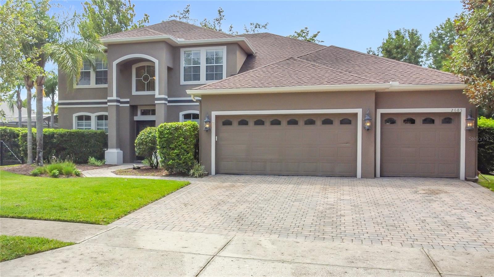 Welcome to an exceptional five-bedroom, three-bath home, which boast a full home solar system, ensuring energy efficiency and cost savings for years to come, in the highly sought-after neighborhood of Live Oak Reserve. This spacious and beautiful residence features a bright open floor plan with light grey paint throughout, kitchen boasts Corian countertops, 42" wood cabinets, and seamless flow into the family room, perfect for entertaining. Sliding glass doors open to a large covered rear porch and fully fenced backyard, offering the ideal space for outdoor living. The first floor includes a generous primary suite with a relaxing sitting area, walk -in closets, bathroom with dual sinks, shower and garden tub. First floor also has private guest suite with bath, separate dining and french doors leading into the formal living room/office space. Upstairs, you'll find three additional bedrooms, a full bath, and a versatile oversized bonus room. Roof 2018, Solar 2019, plus three-car garage and paver driveway completes this impressive home—ready for you to move in and enjoy!